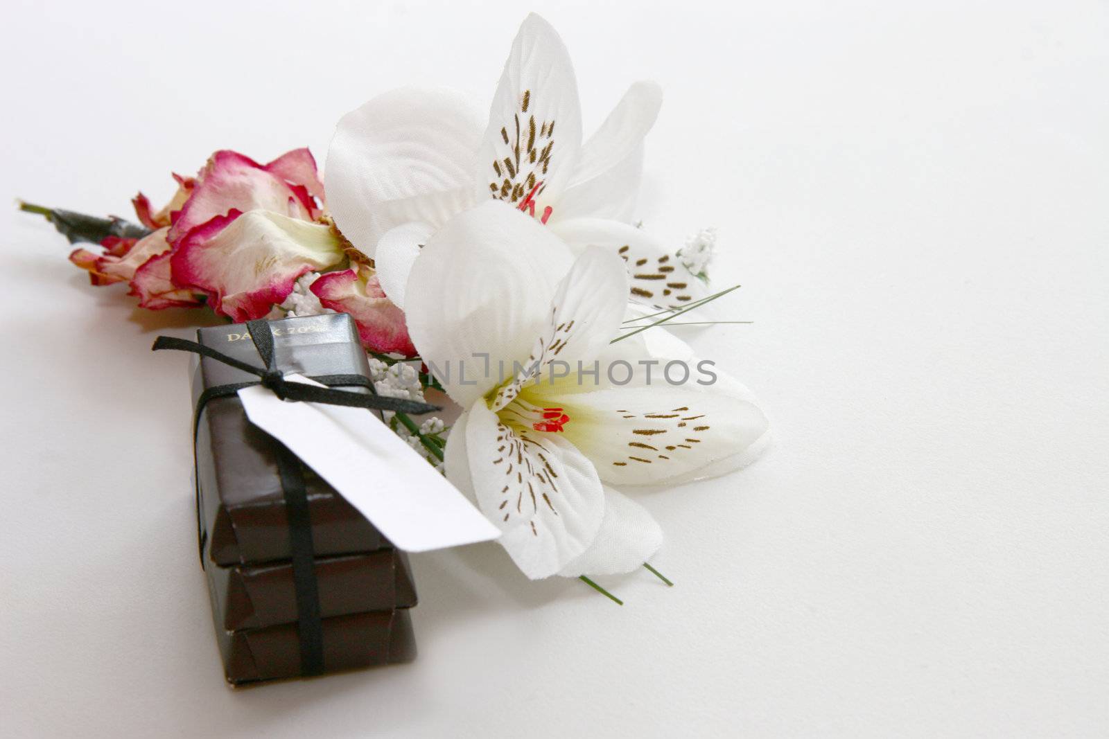 chocs and flowers concept of a gift background