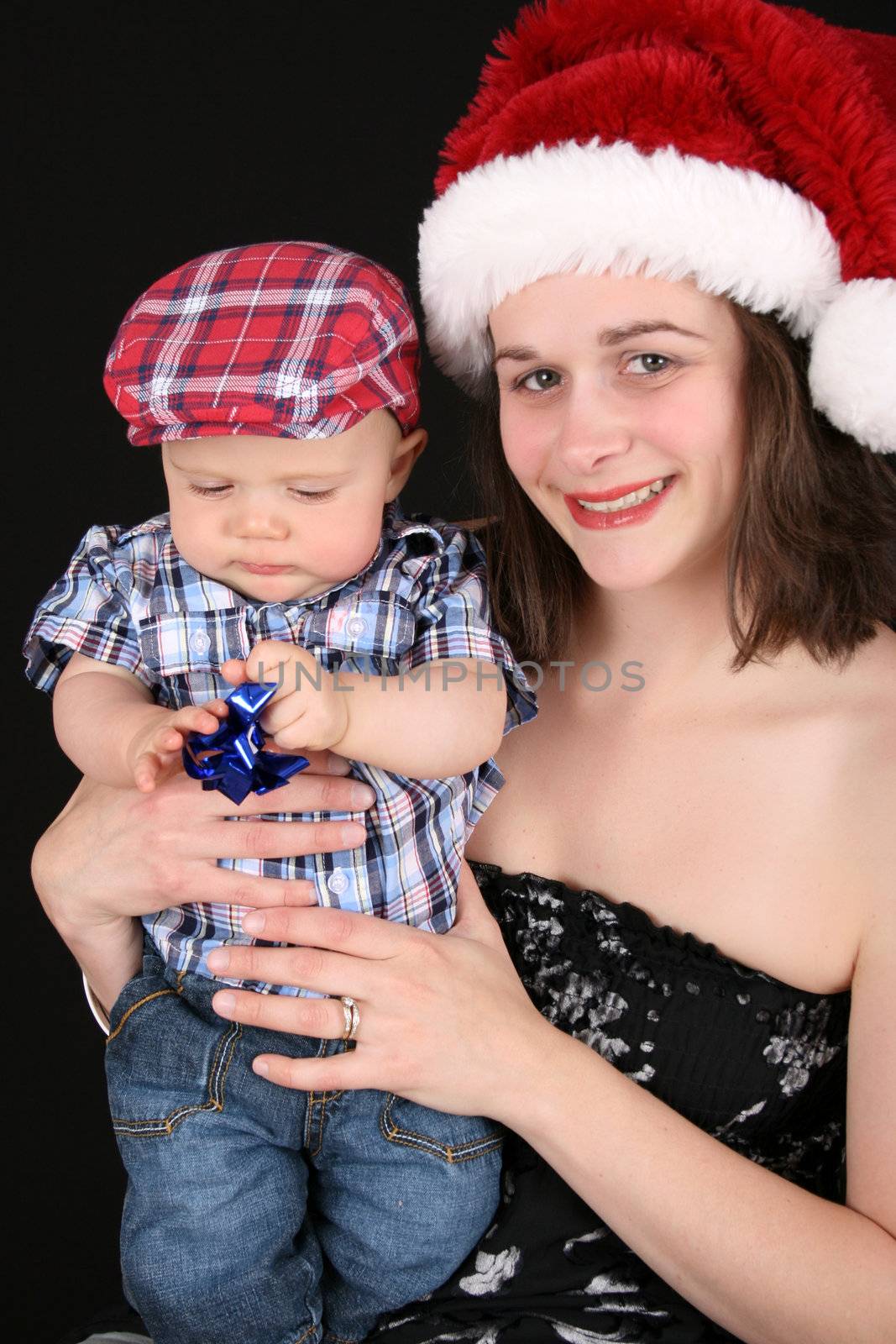 Beautiful christmas mother and son on a black background