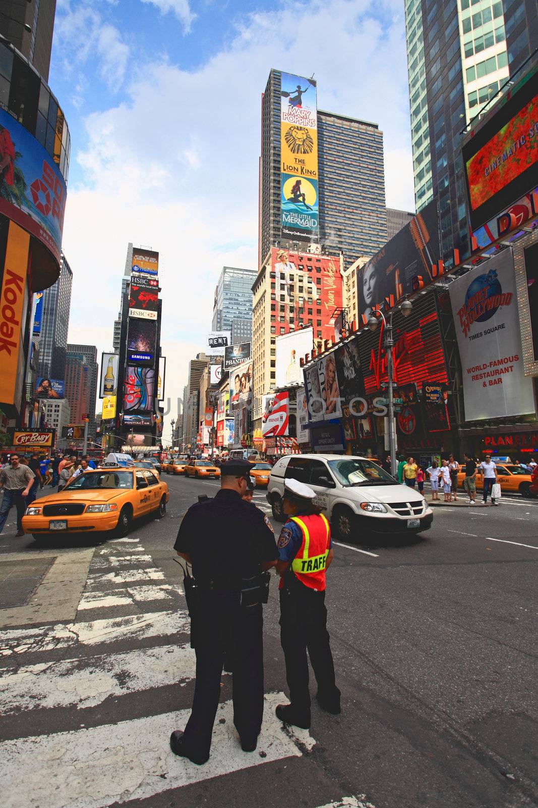 The famous Times Square at Mid-town Manhattan - a wide angle view