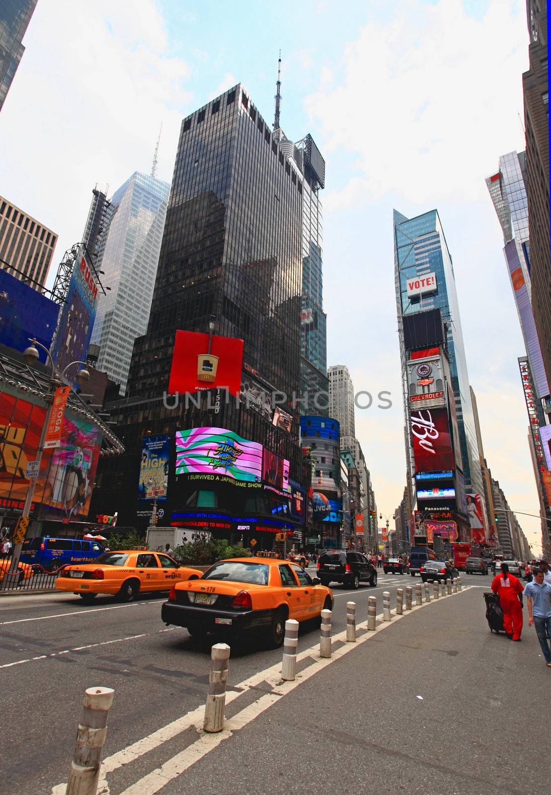 The famous Times Square at Mid-town Manhattan - a wide angle view