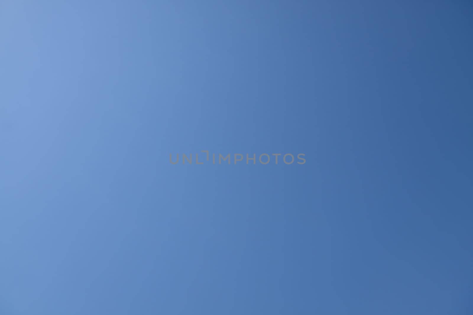 Clear blue sky with the sun light coming from the upper left