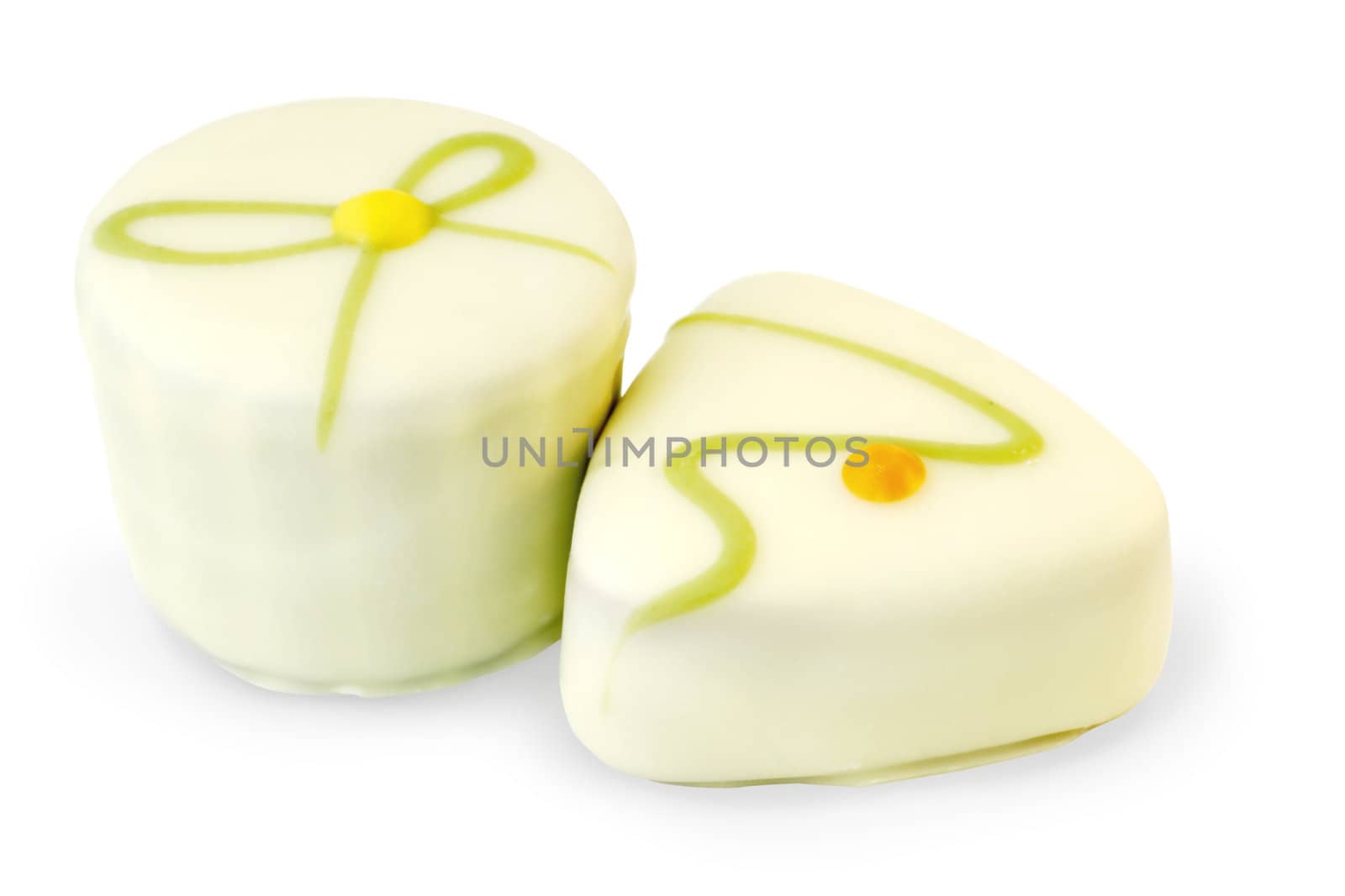 Two delicious, beautiful and fancy white chocolate candy filled with praline isolated on white background.