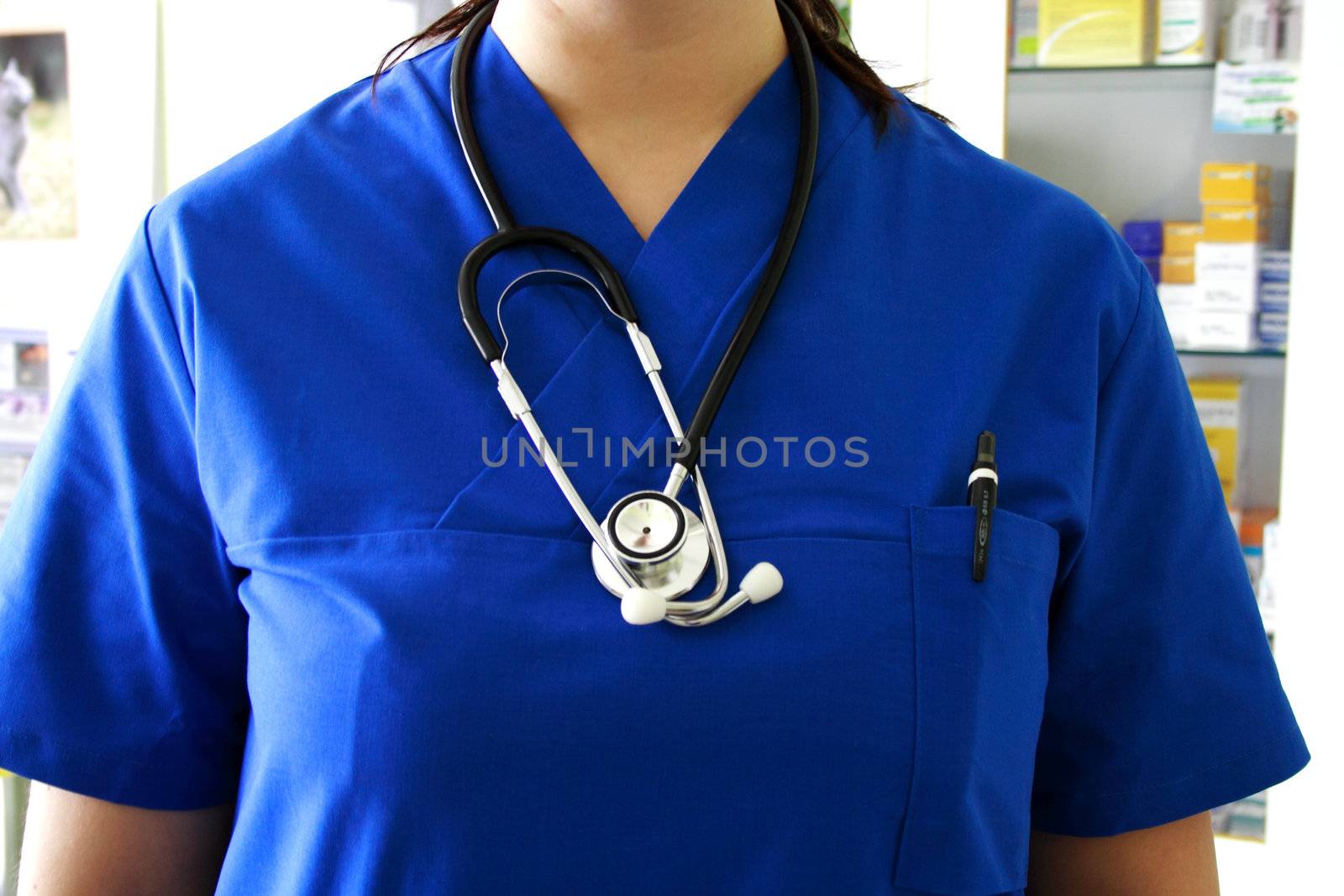Closeup of blue nurse uniform and stethoscope