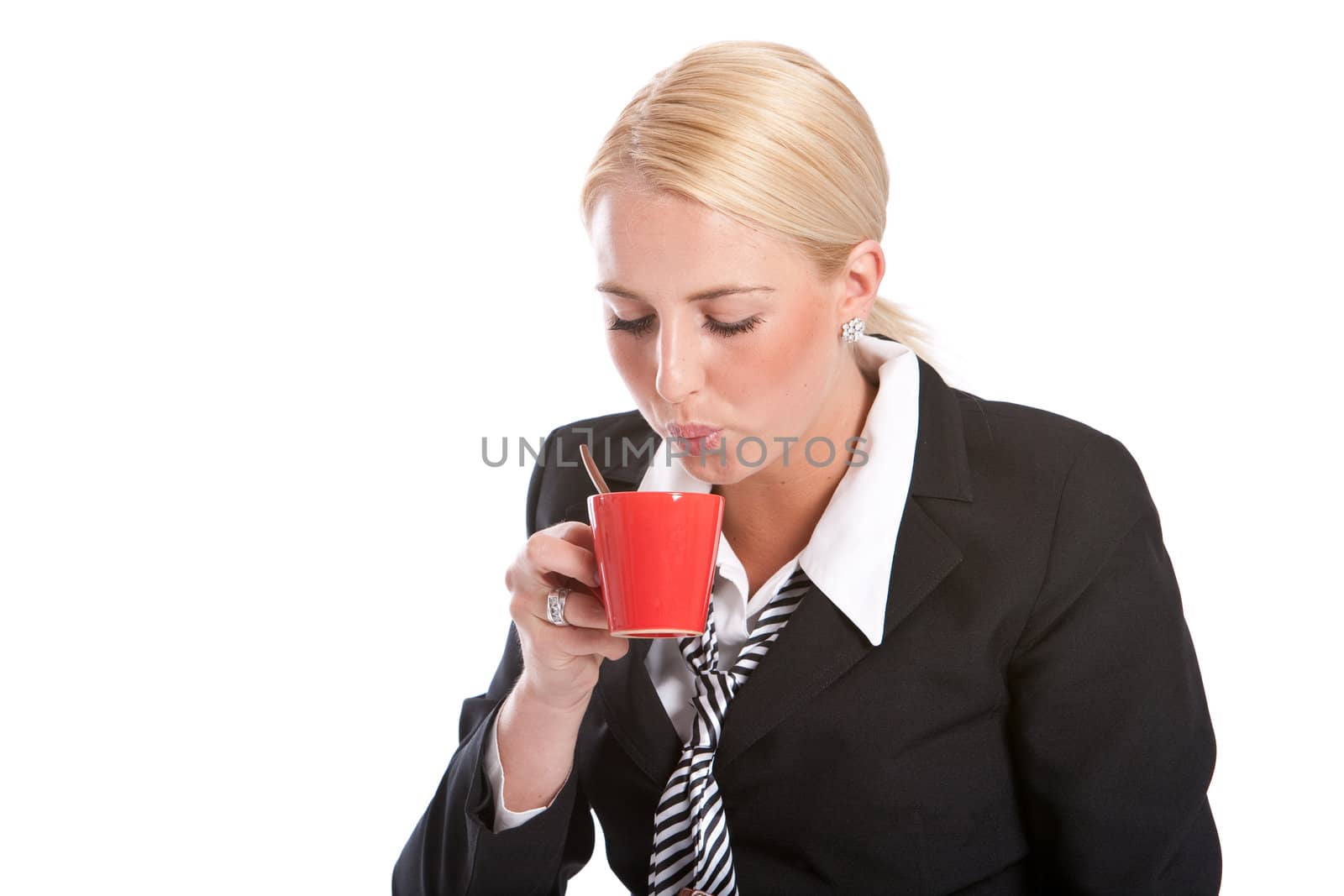 Attractive young businesswoman sitting and drinking her coffee