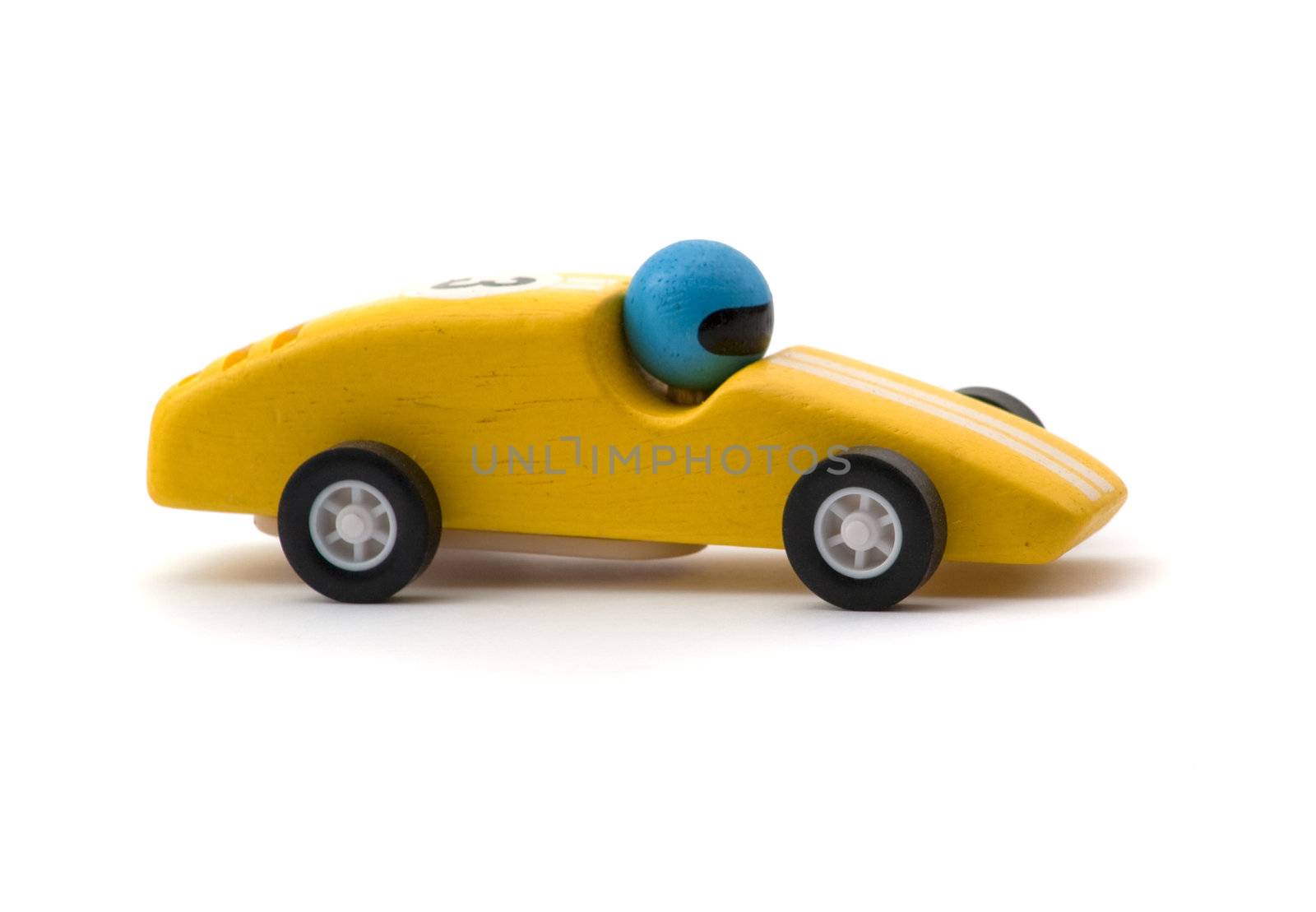 yellow racing toy car on white background