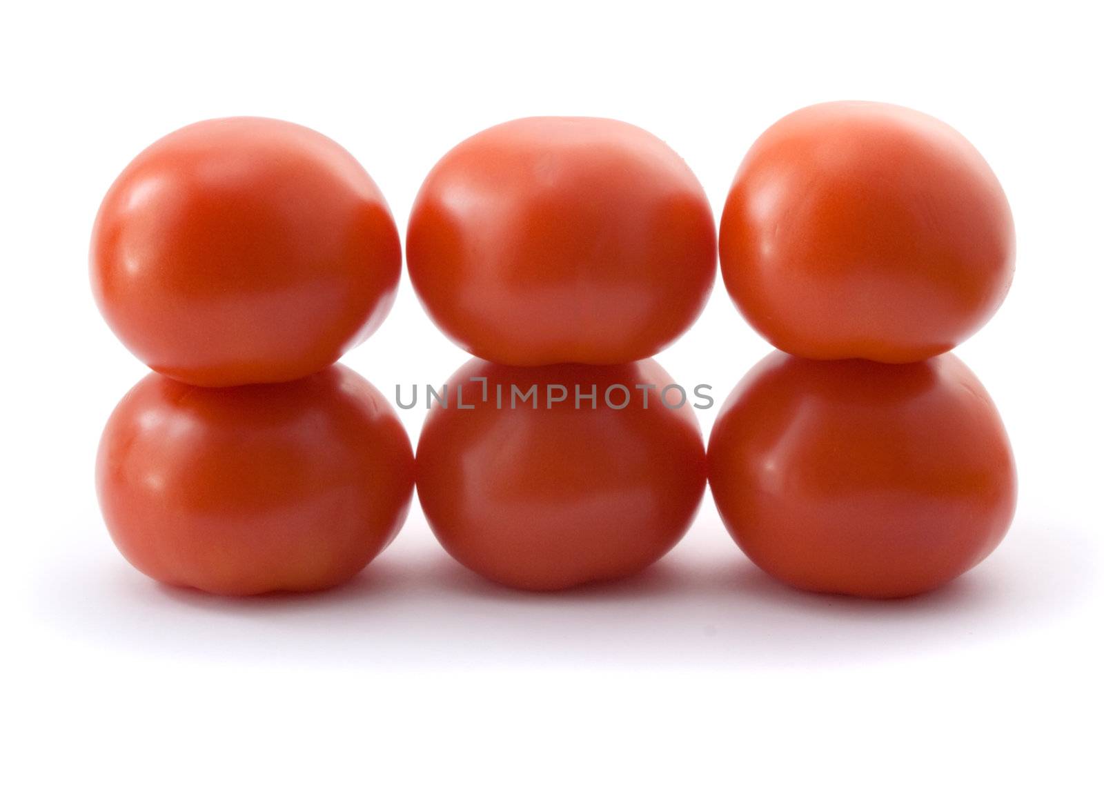 six fresh red tomatoes on white background