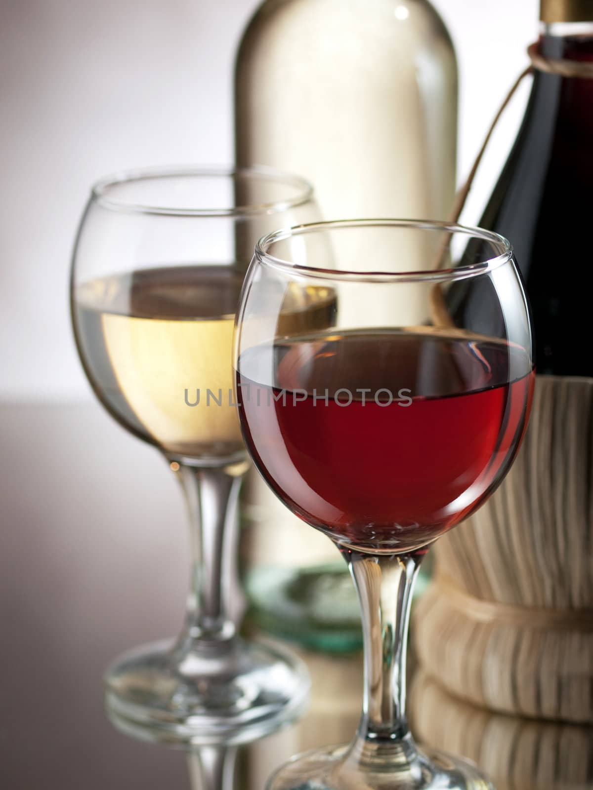 Red and white wine in elegant setting