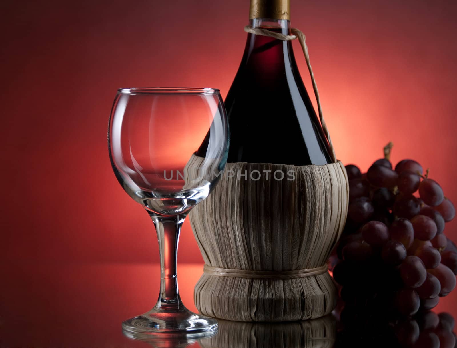 Red wine, glass and bottle