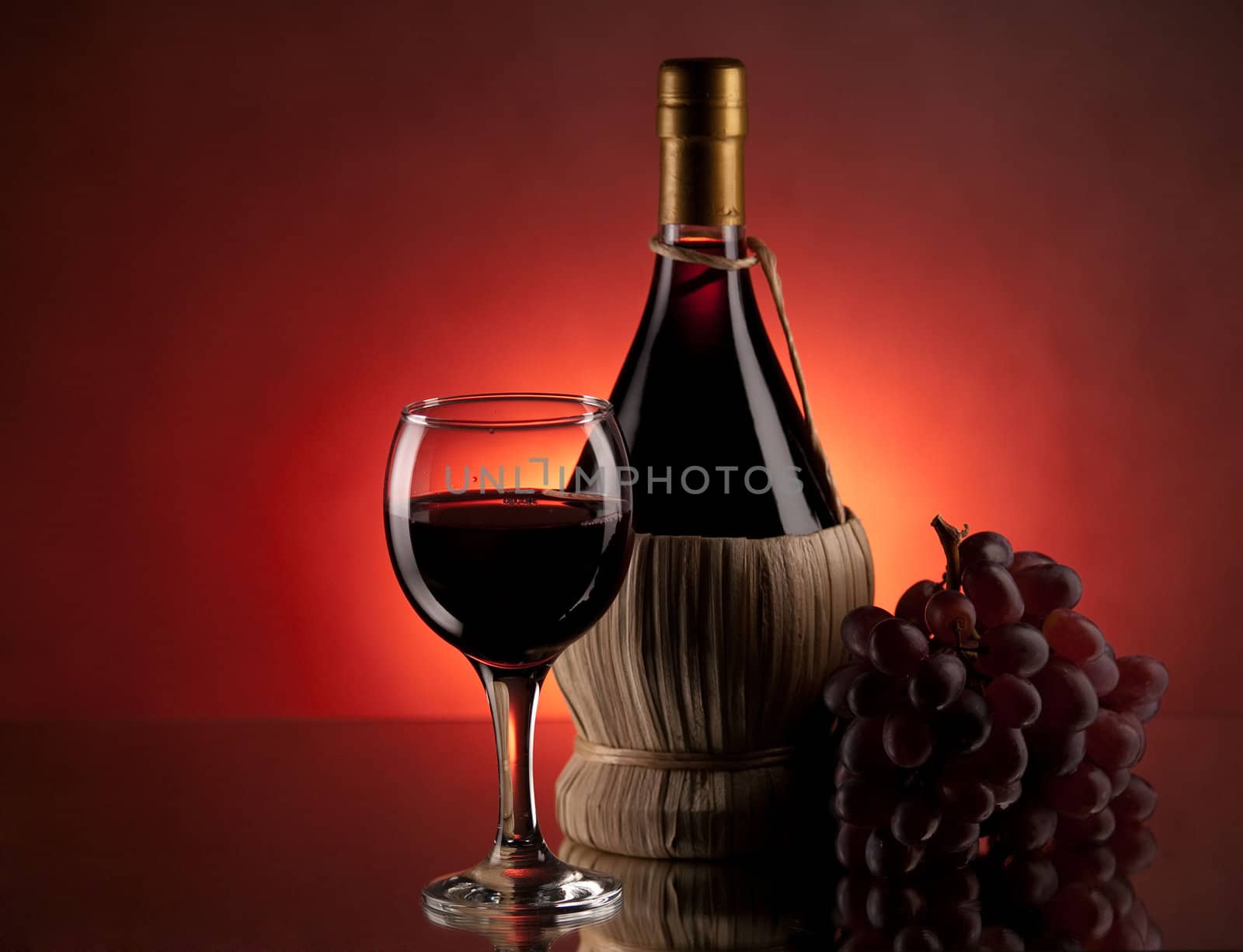 Red wine, glass and bottle