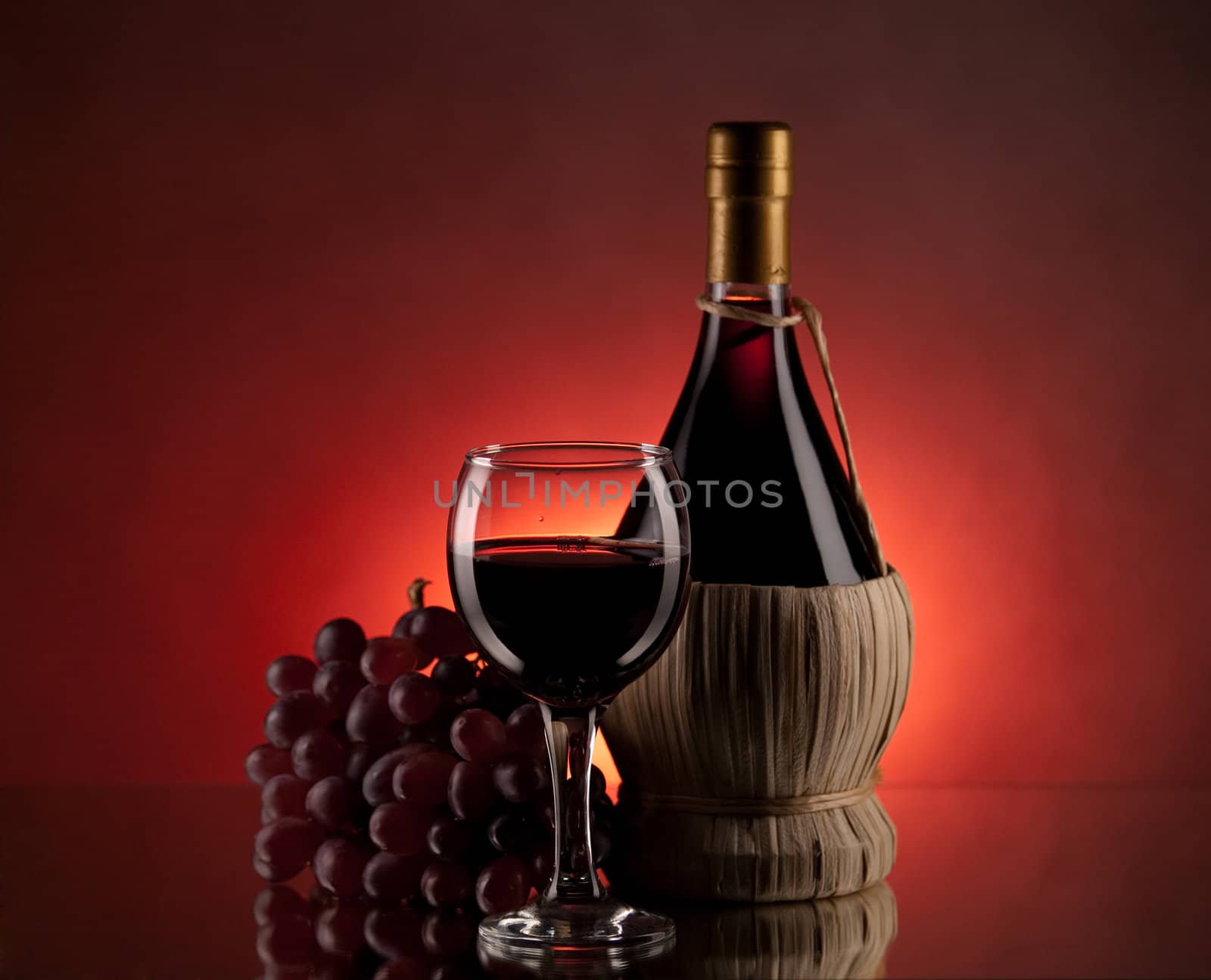 Red wine, glass and bottle