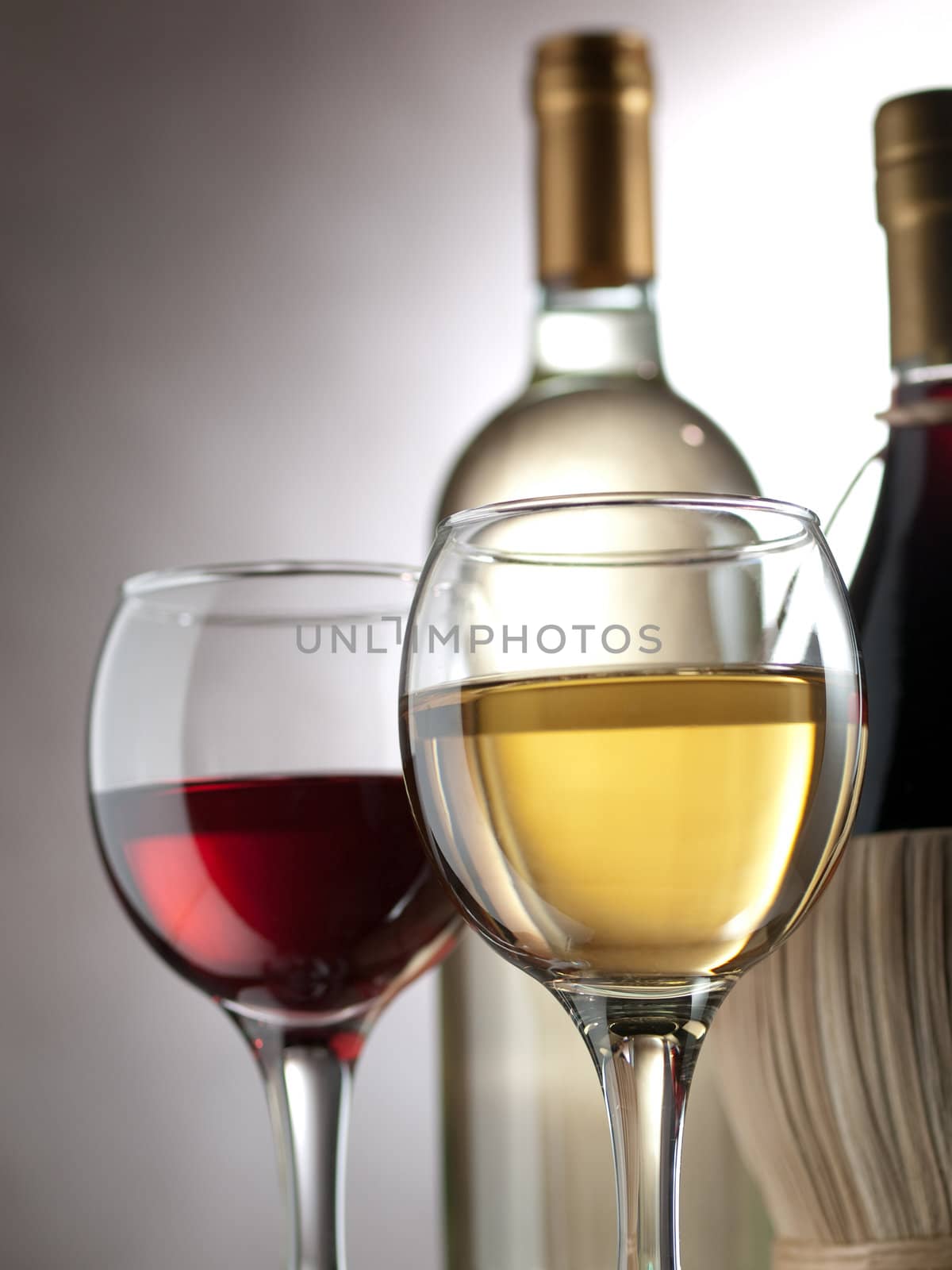 Red and white wine in elegant setting