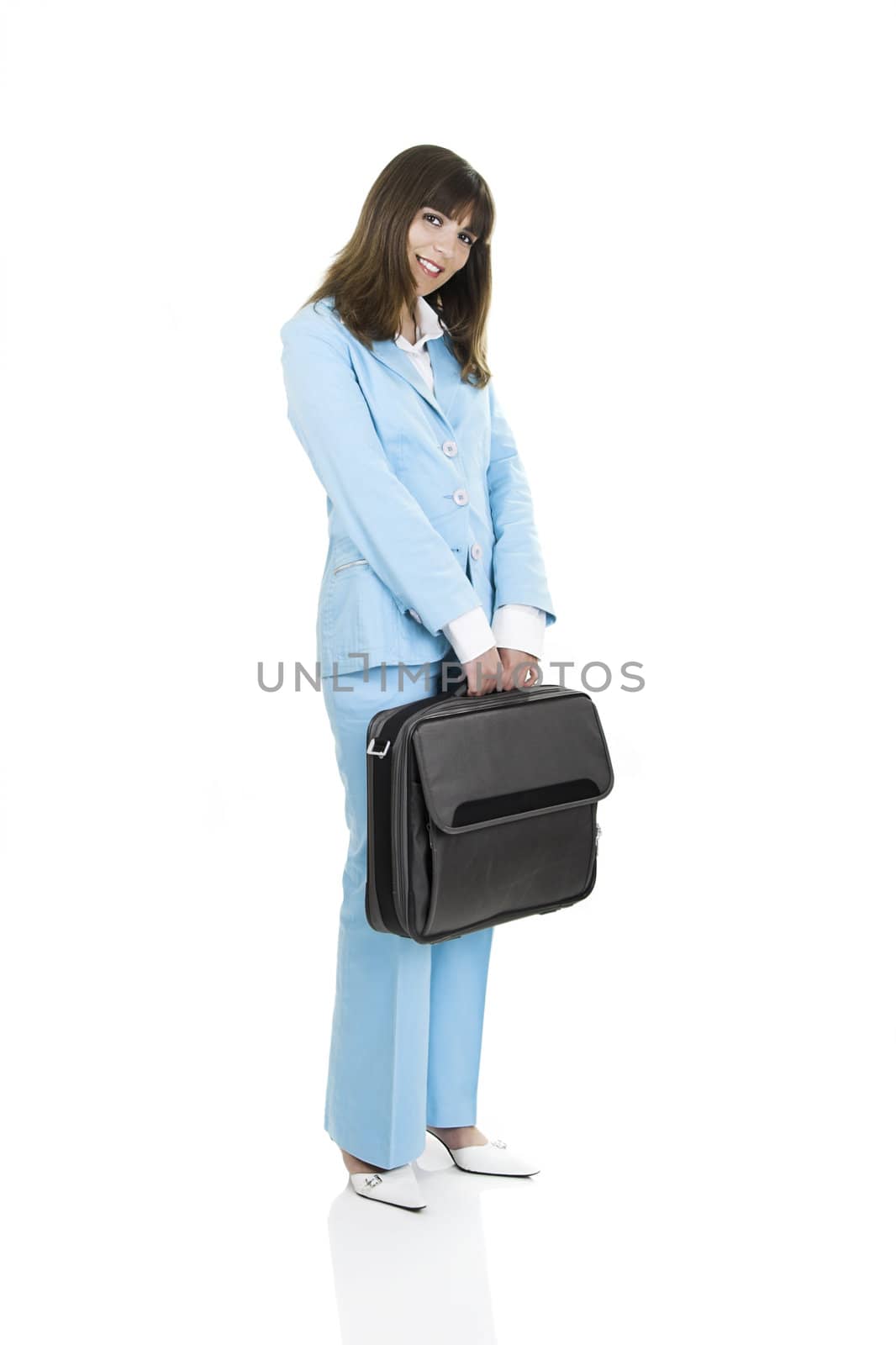Business active woman standing over a white background with a briefcase in her arms