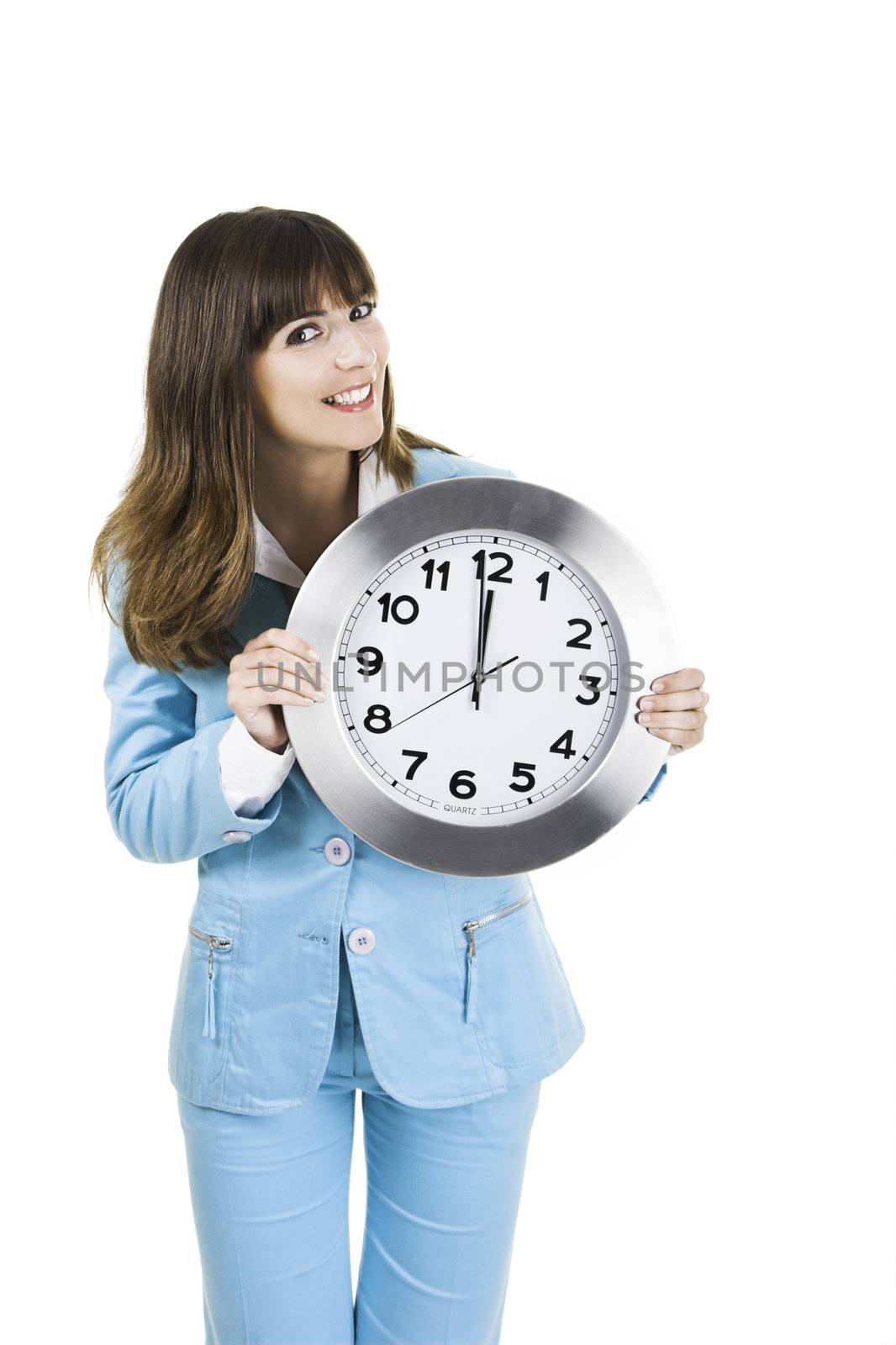 Beautiful woman standing over a white background with a clock on the face
