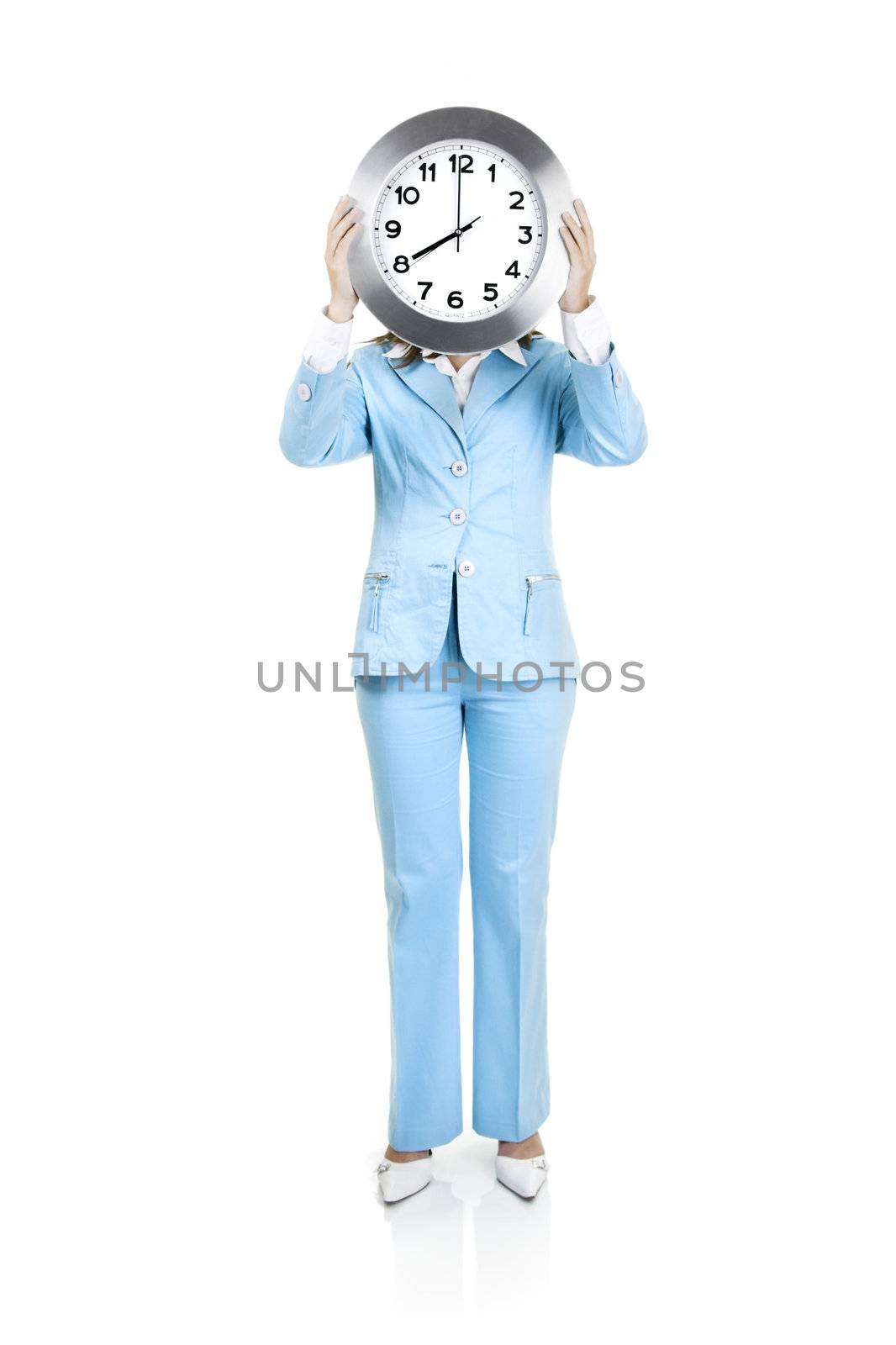 Business active woman standing over a white background with a clock on the face