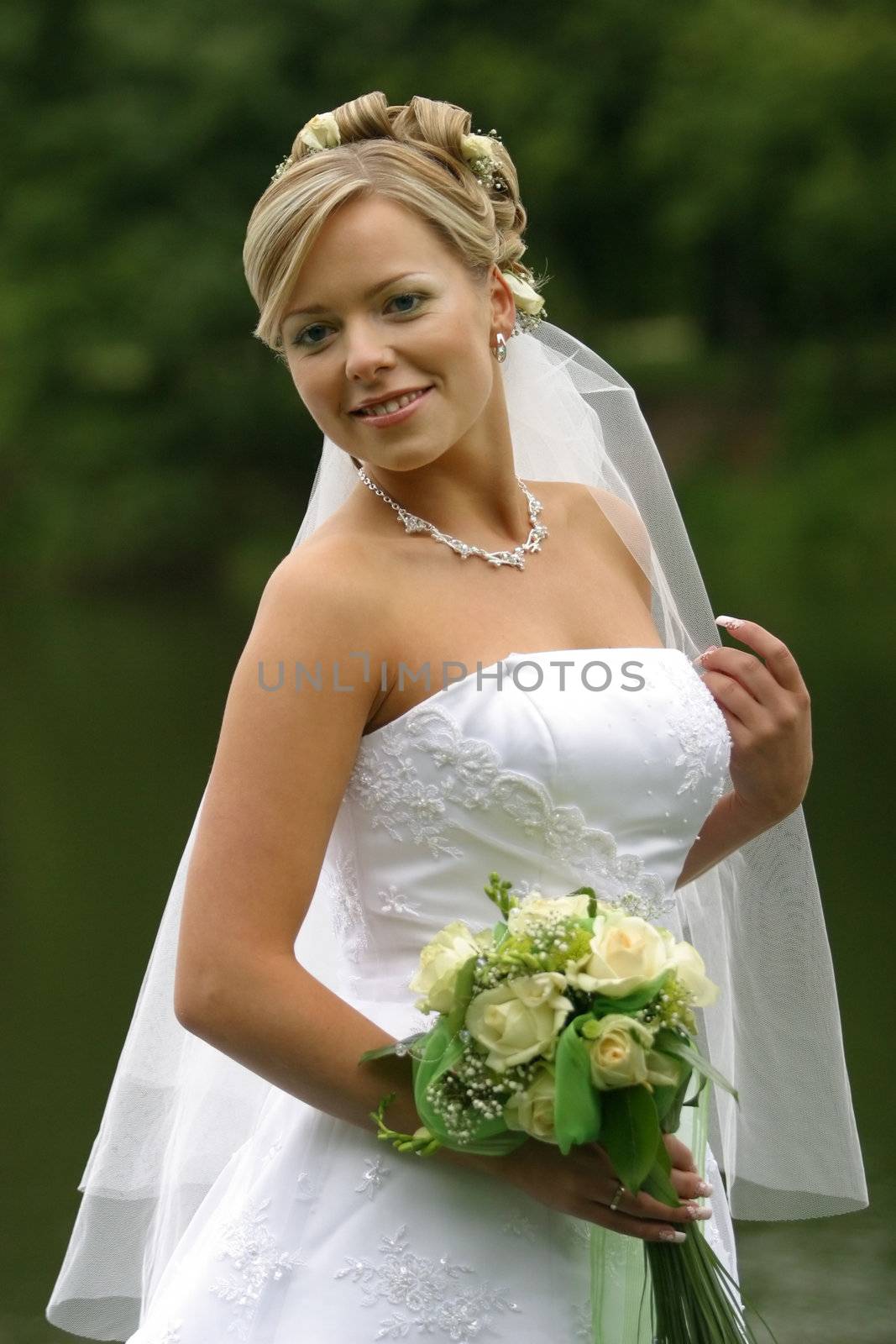 The beautiful bride with a bouquet from roses