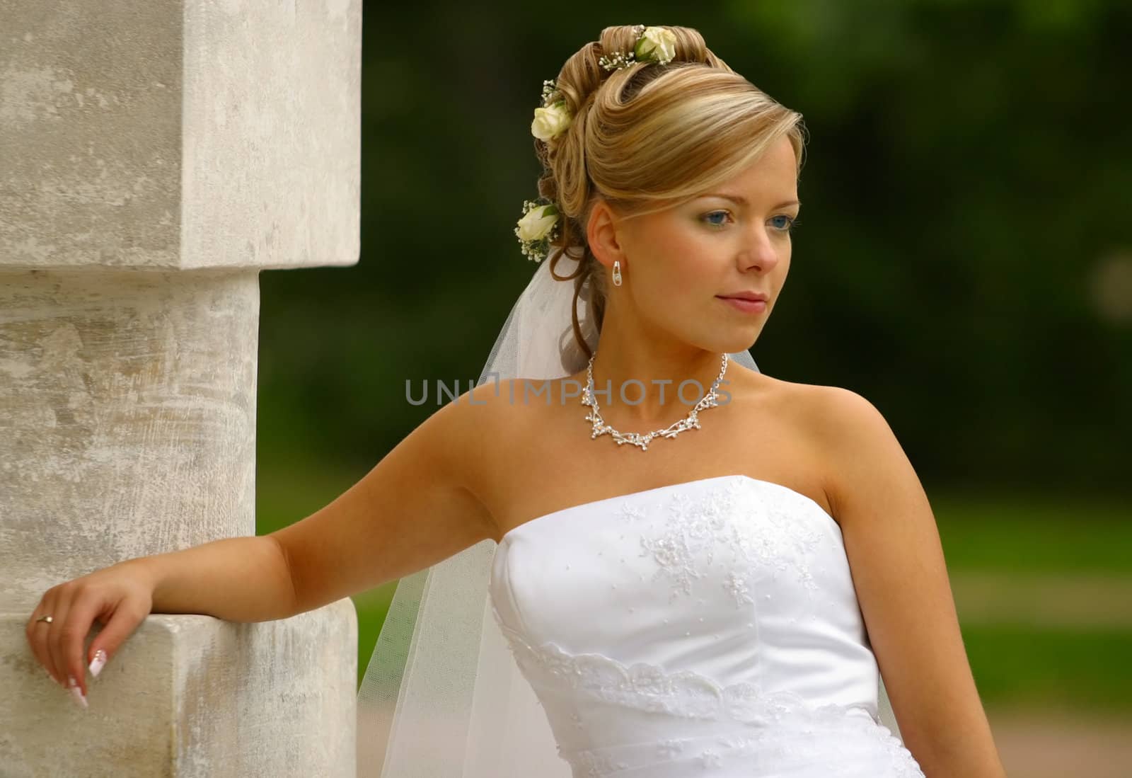 Portrait of the beautiful bride with a bouquet