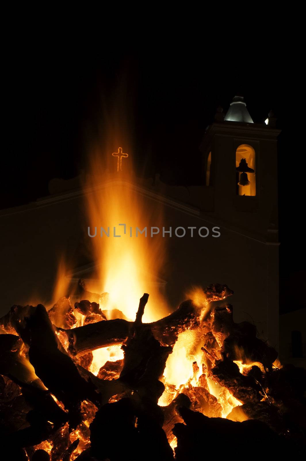 Big festive fire in a square at a portuguese village