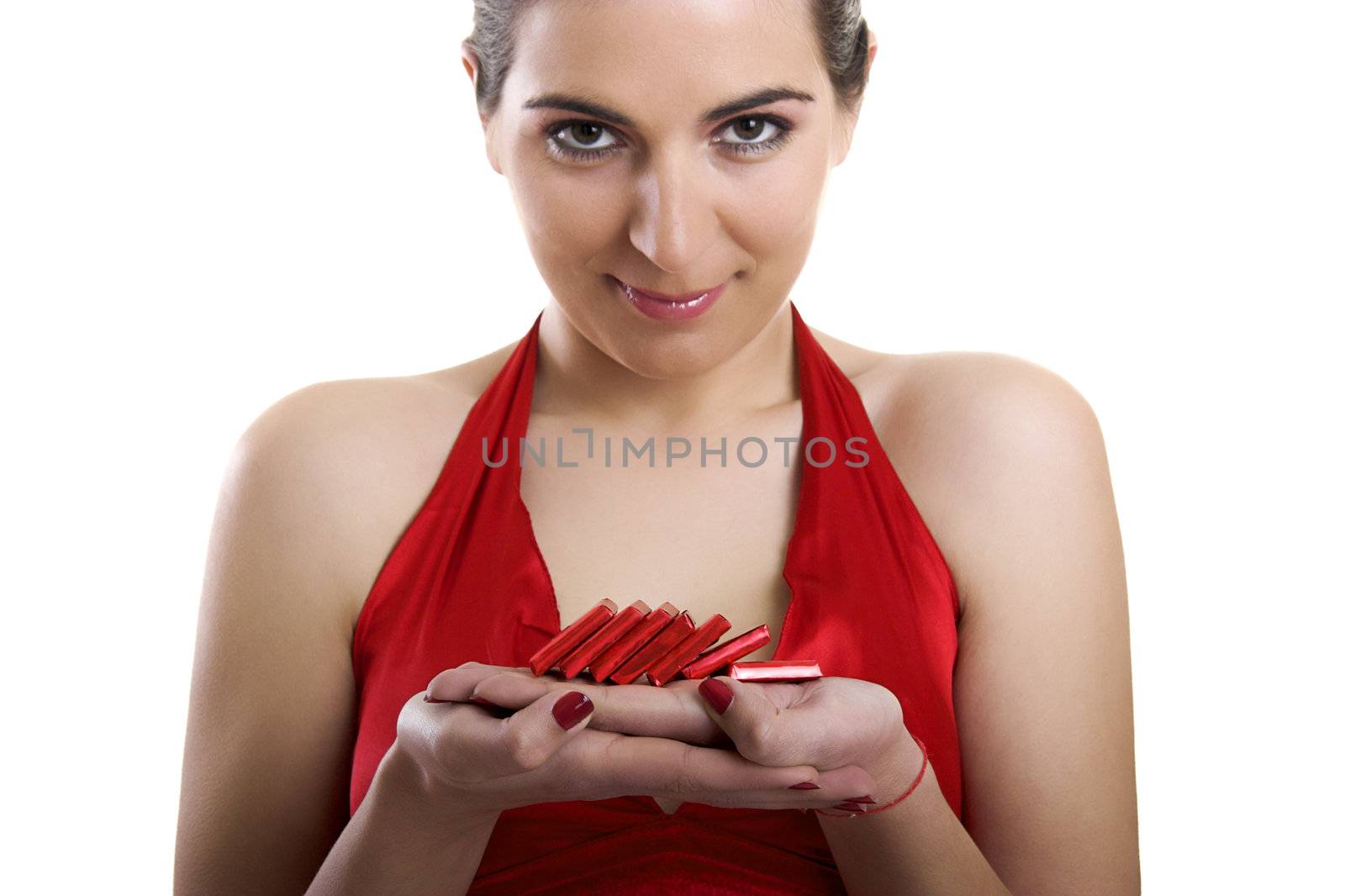 A beautiful woman satisfying a chocolate candy