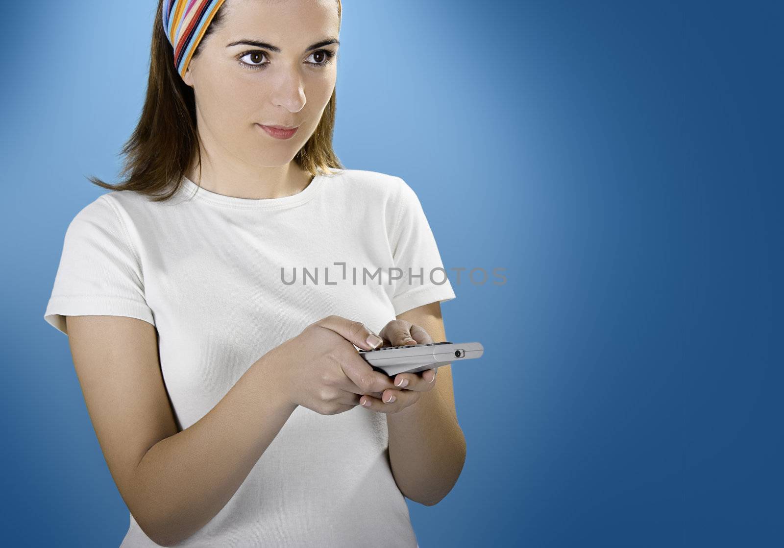 Woman with a remote control over a blue background