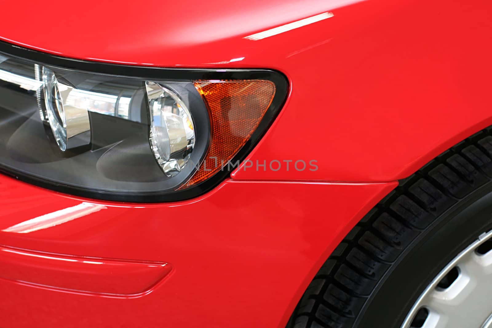 Beautiful headlight of the red sports car