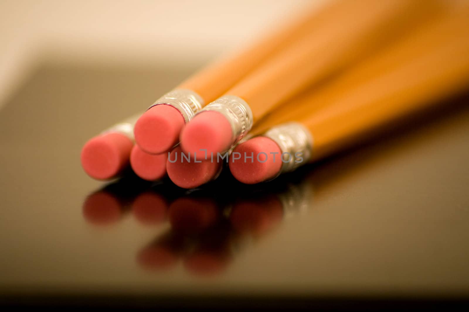 Erasers on Wood Pencils v1 are captured using depth of field with a reflection and nice perspective.
