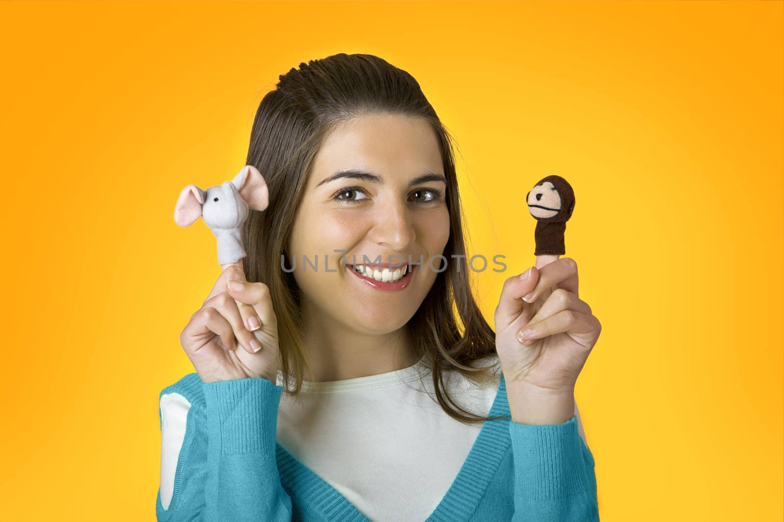 Beautiful woman playing with puppets on the fingers