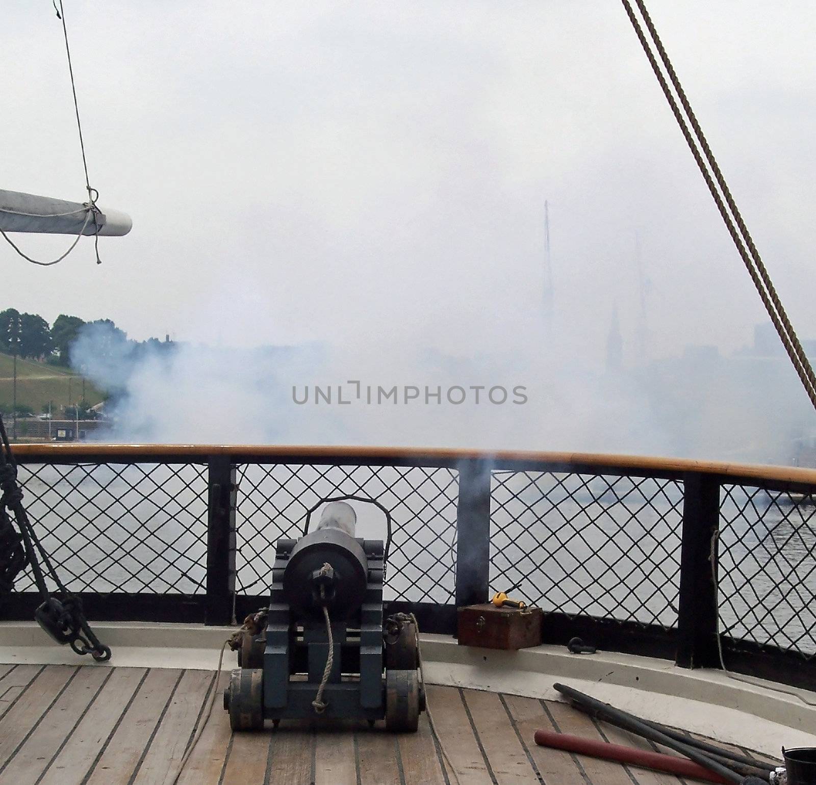 A canon is fired on the USS Constellation in Baltimore Harbor. The ship is now a museum and was in service during the mid 1800's and was used to intercept three slave trading ships and free the imprisoned slaves. It was also used to carry famine relief stores to Ireland.