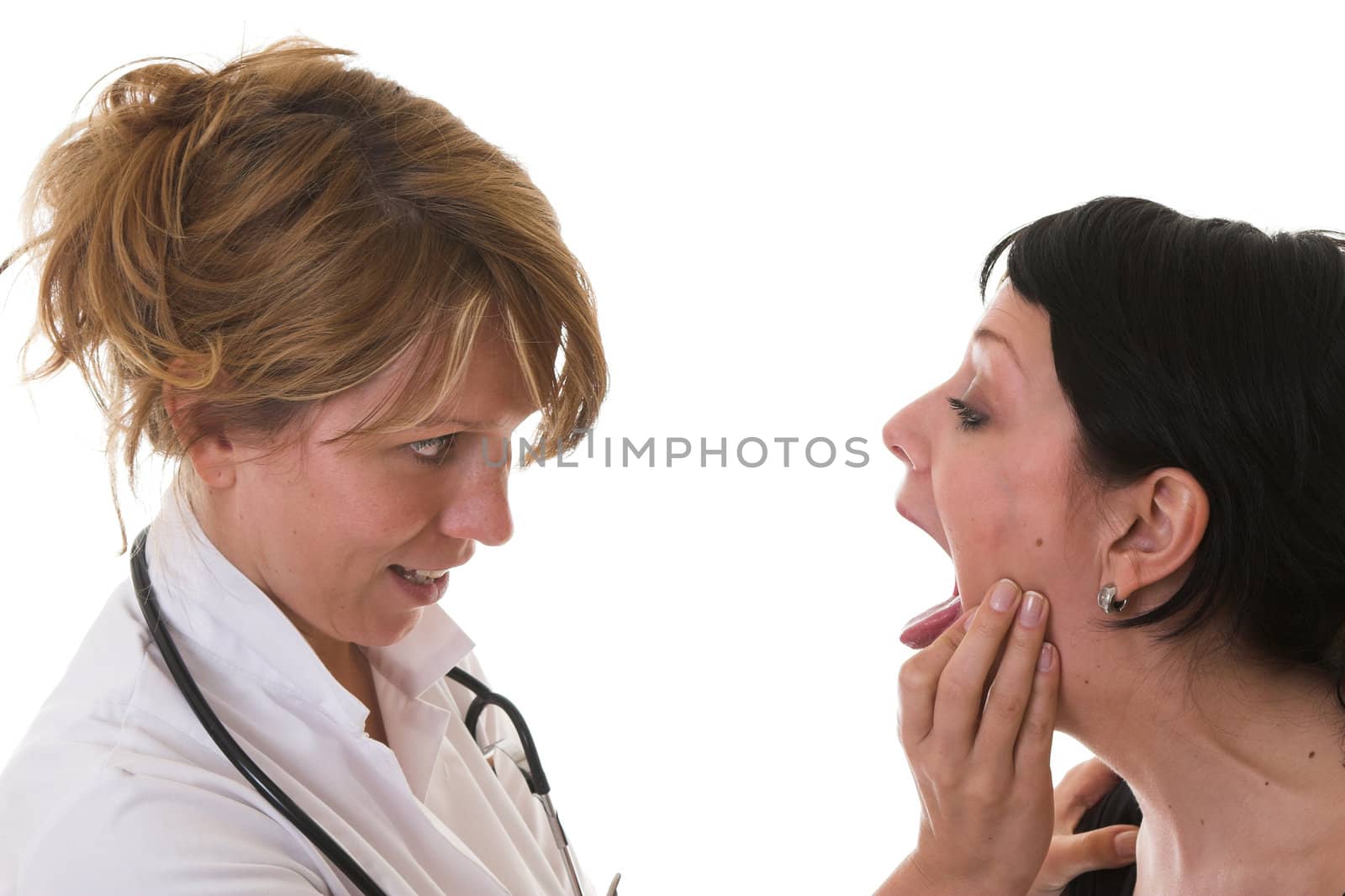 Female doctor checking out her patient by Fotosmurf