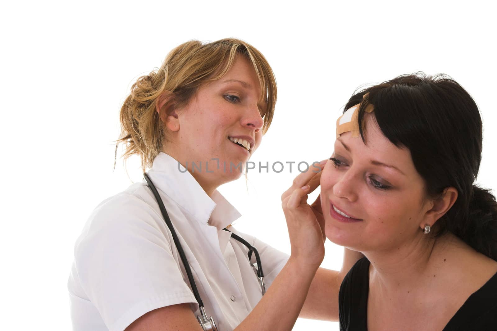 Nurse checking out the ear of her patient on white background