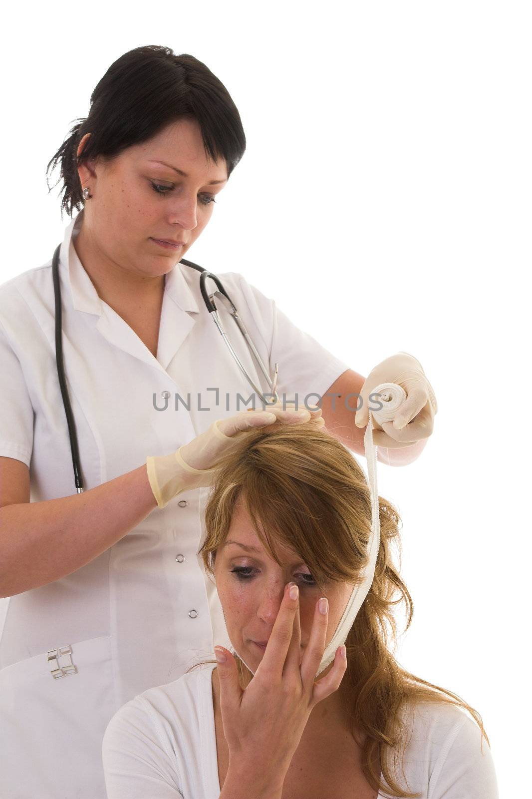 Nurse bandaging a patient by Fotosmurf