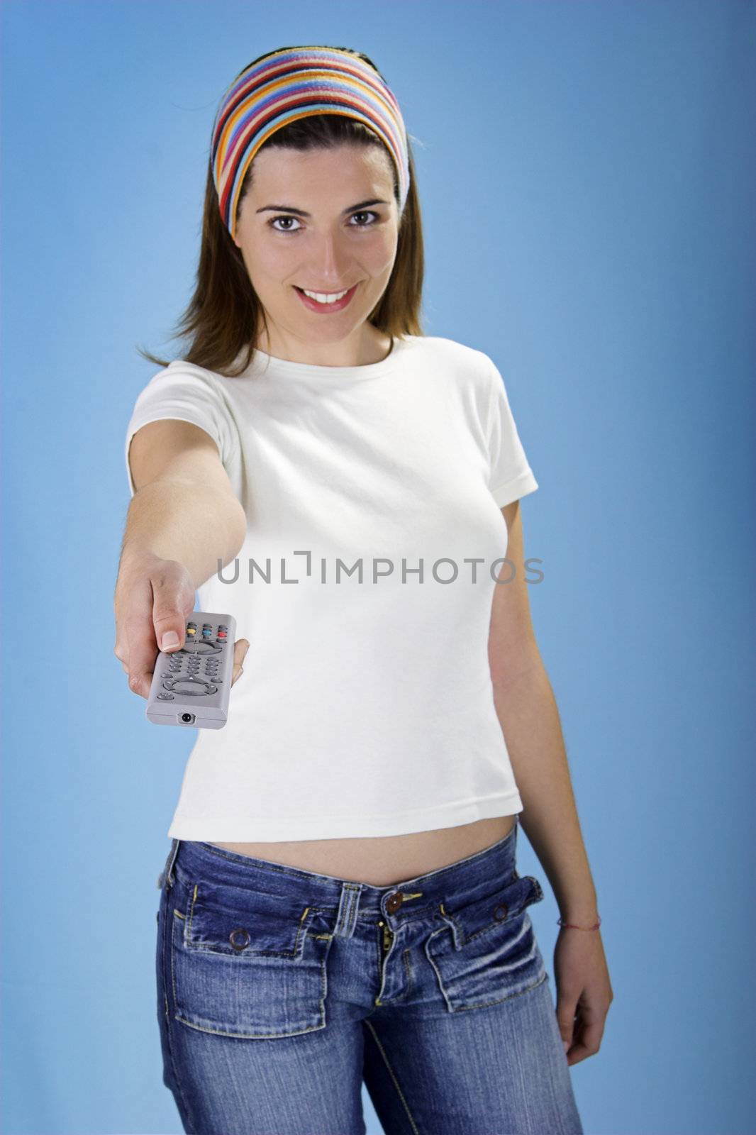 Woman with a remote control over a blue background
