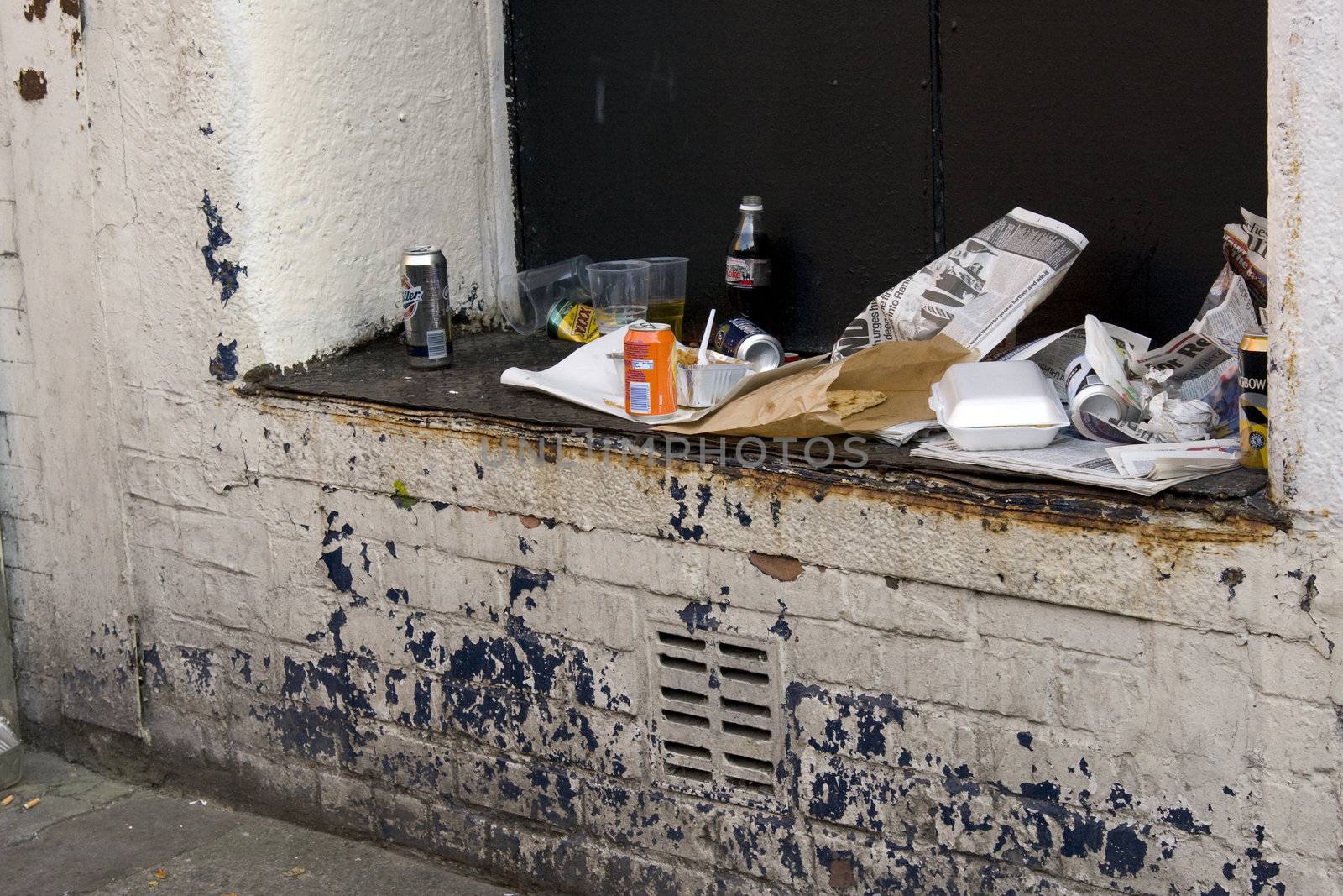 Rubbish left on a wall in an urban environment