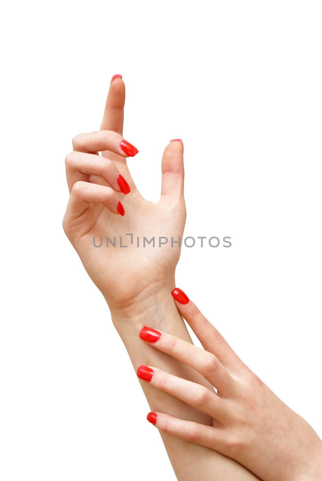 A girl shows off her new nails in a manicure pose.