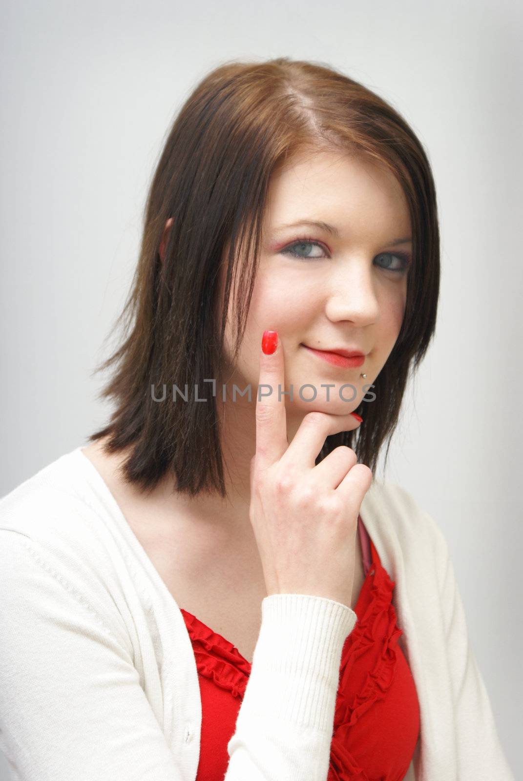 A young girl portrait looking at the camera thinking.