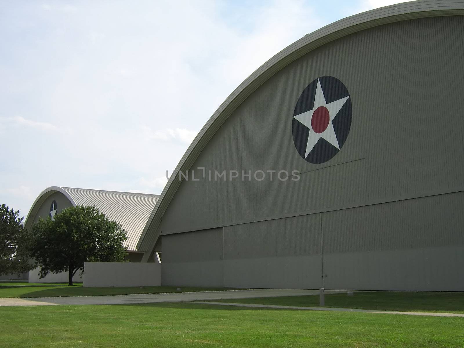 A photograph of large aircraft hangars used to store historic warplanes.