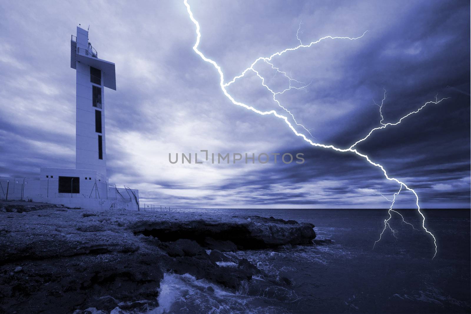 Modern lighthouse with dramatic sky and storm