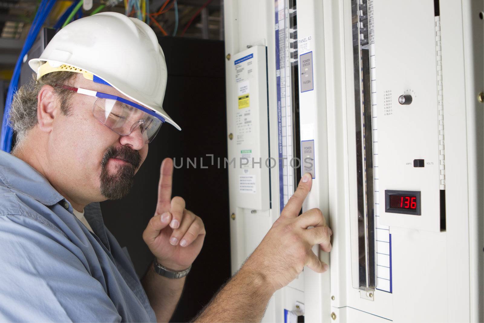 An engineer try to remember the volage levels infront of a power panel, one minute, don't disturb him.