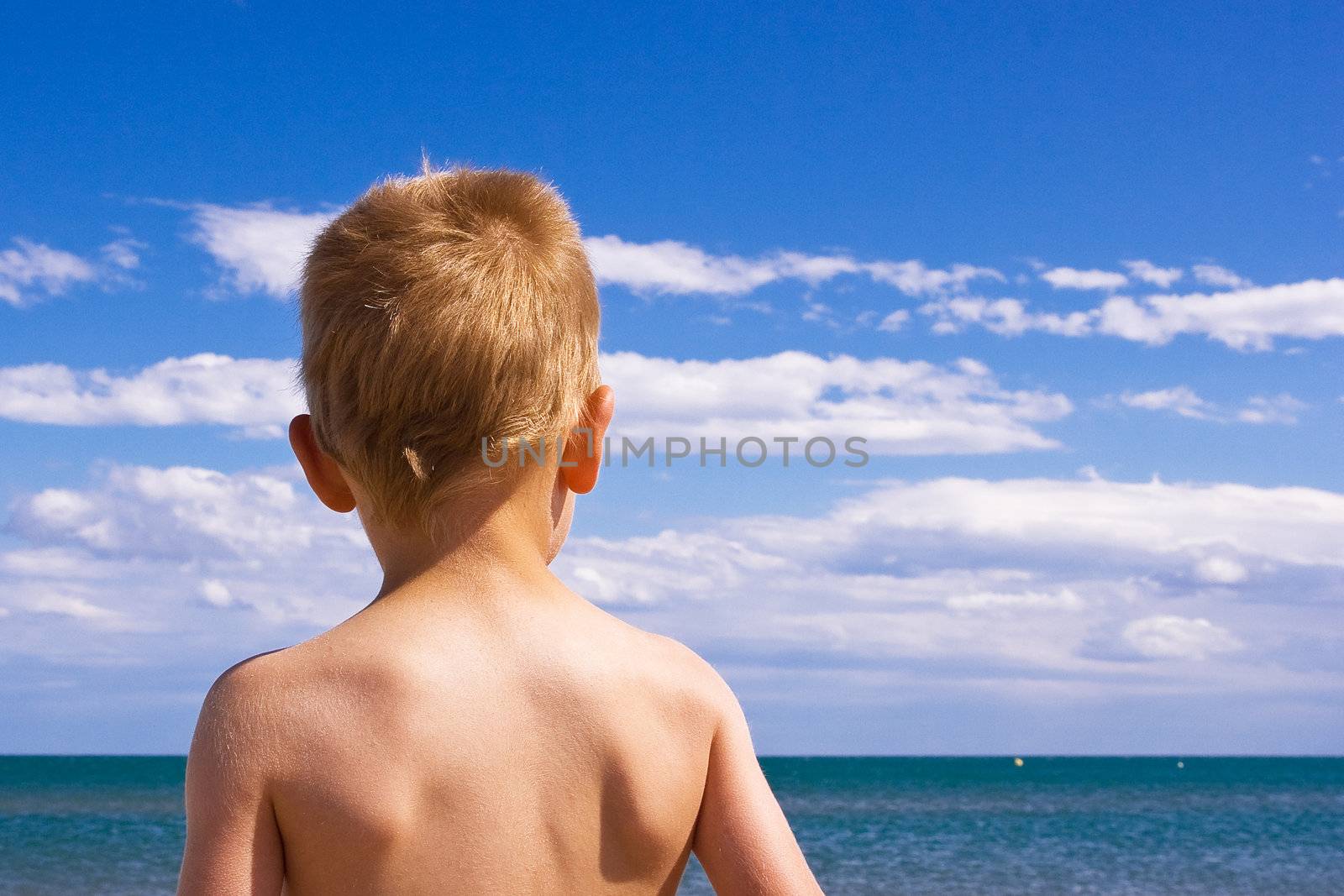 Child on a beach by chrisroll