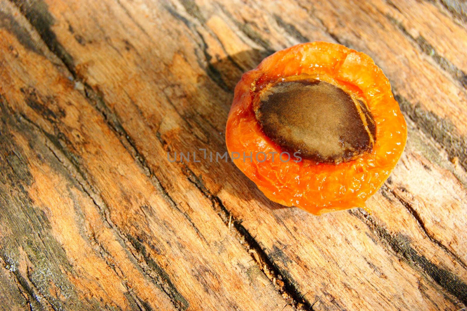 Apricot on wooden background