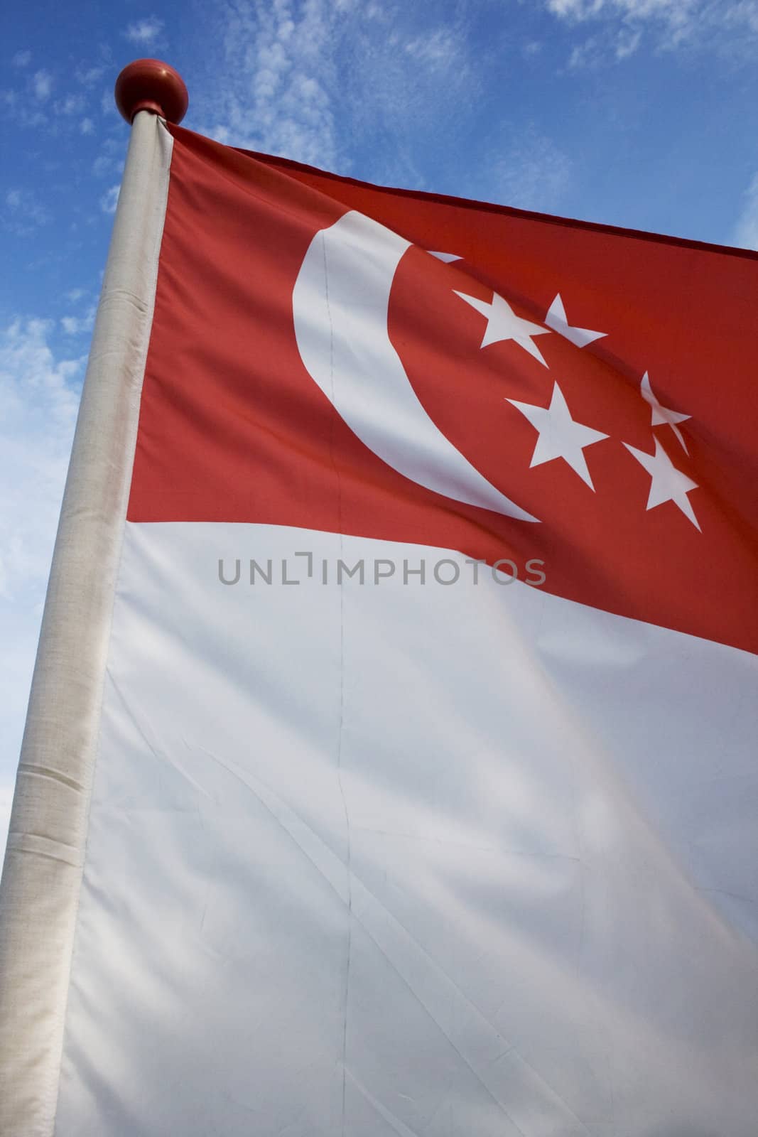 A flying Singapore flag again blue sky