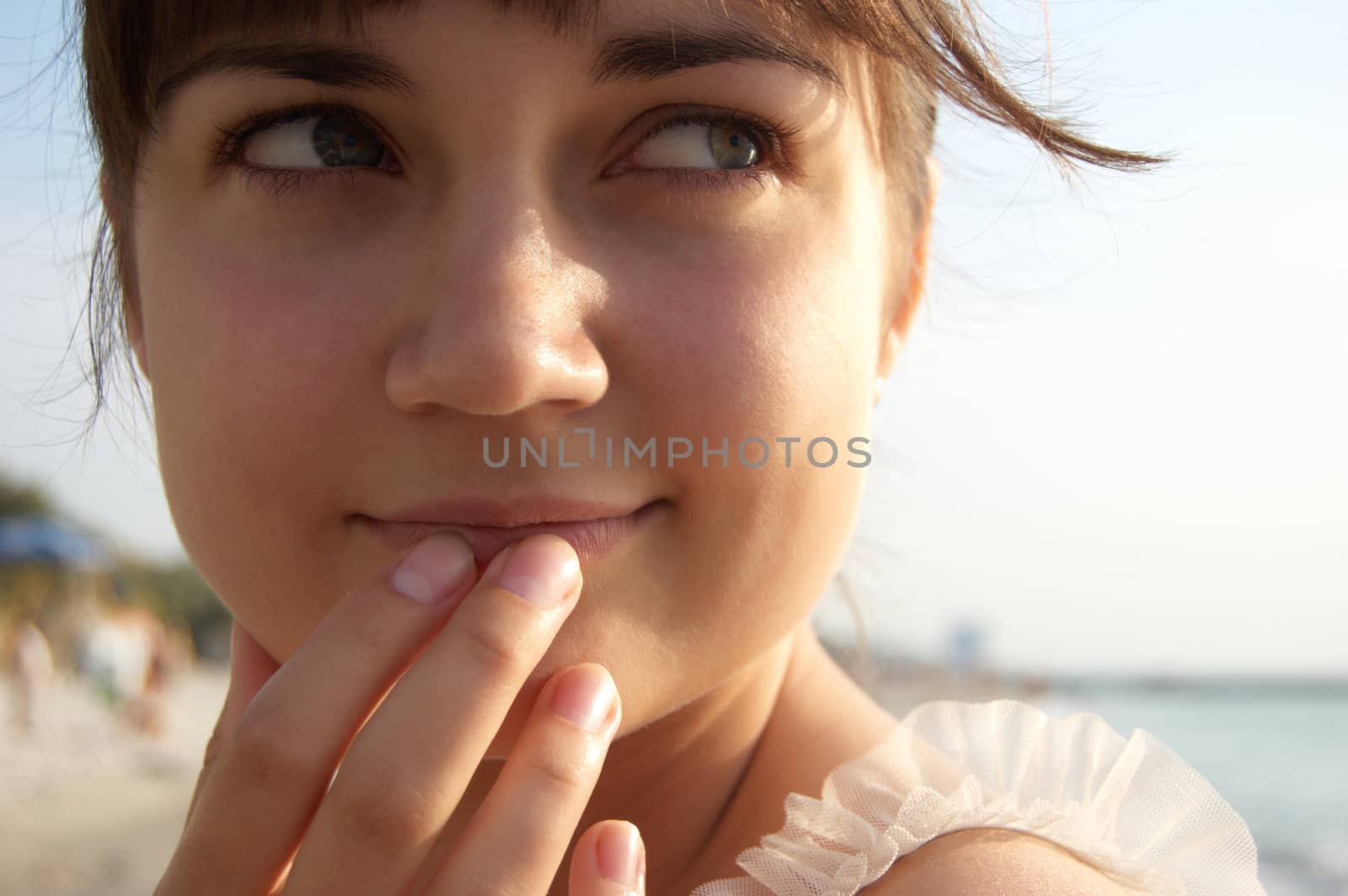 Women's sunset portrait on colored nature background