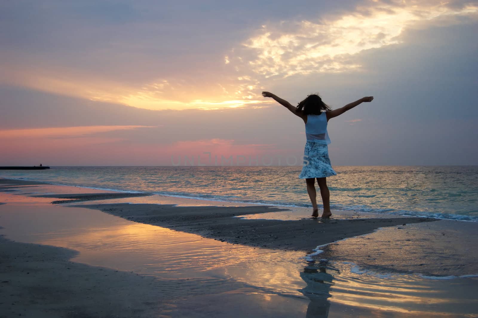 A woman early in the morning on the sea