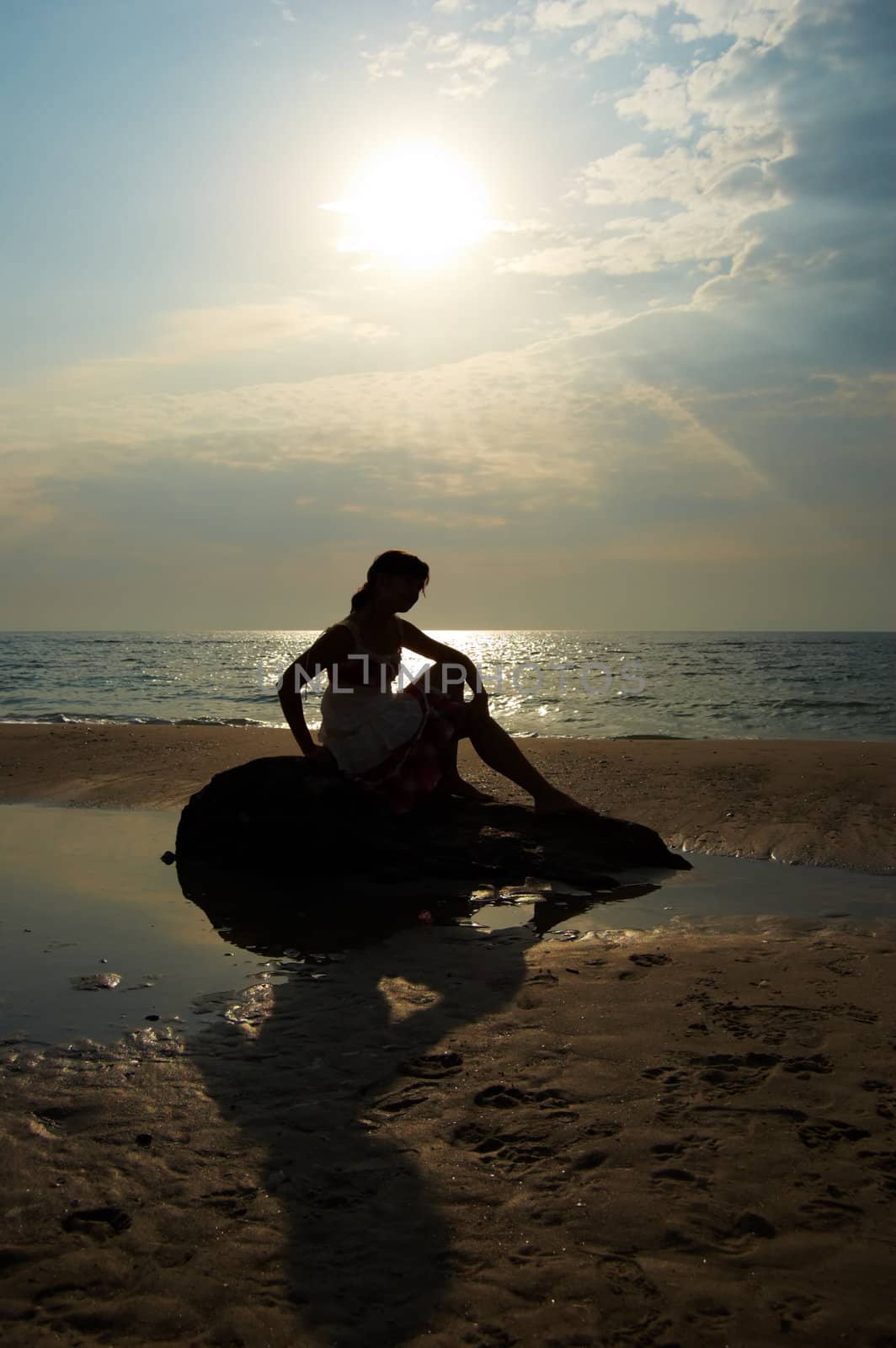 A woman early in the morning on the sea