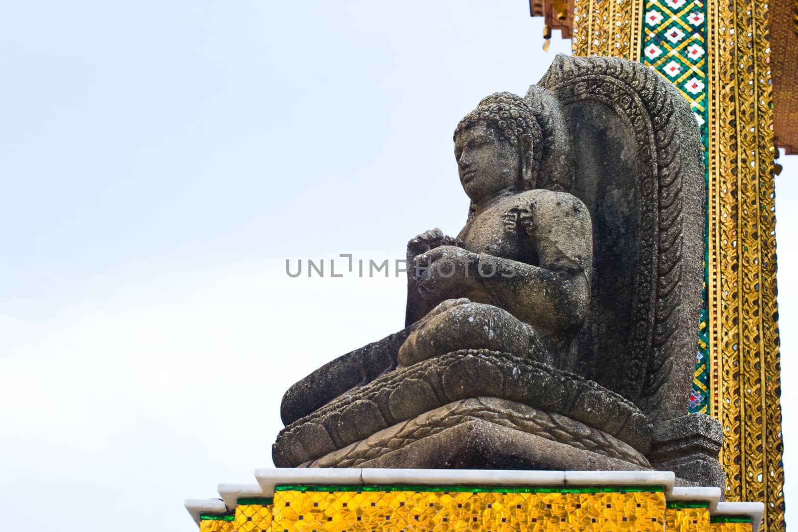 Ancient Stone Buddha statue in the temple by pixbox77