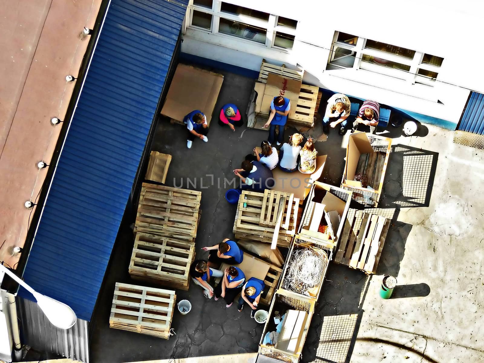 Group of fabric workers on a break, top view by DK1vision