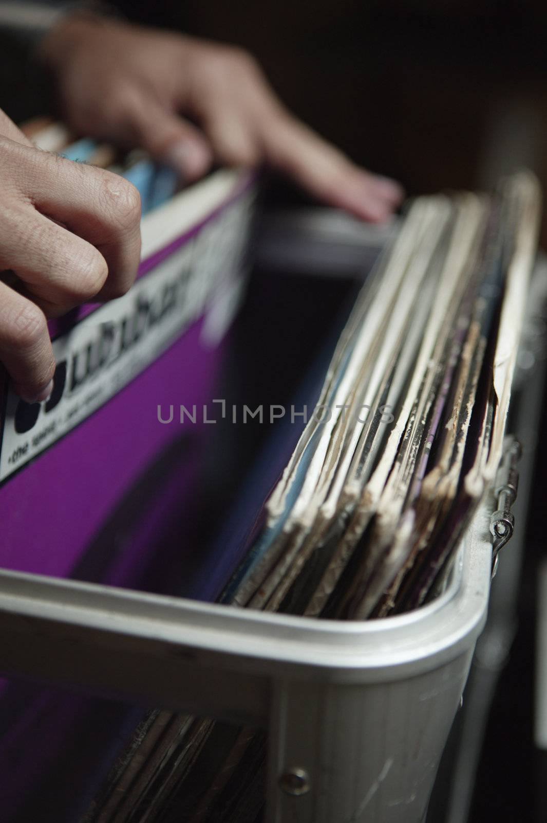 Person Looking Through Crate of Records