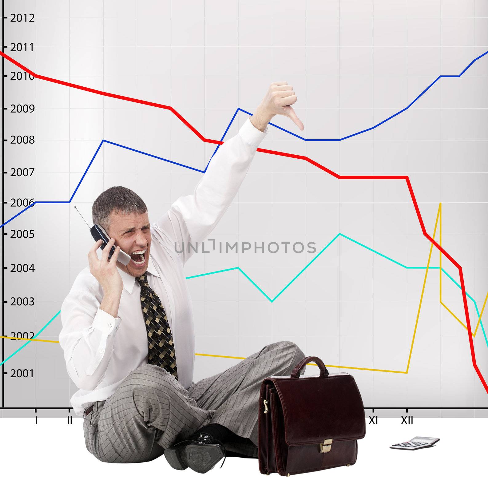 The businessman angry falling of exchange indexes phones in company office