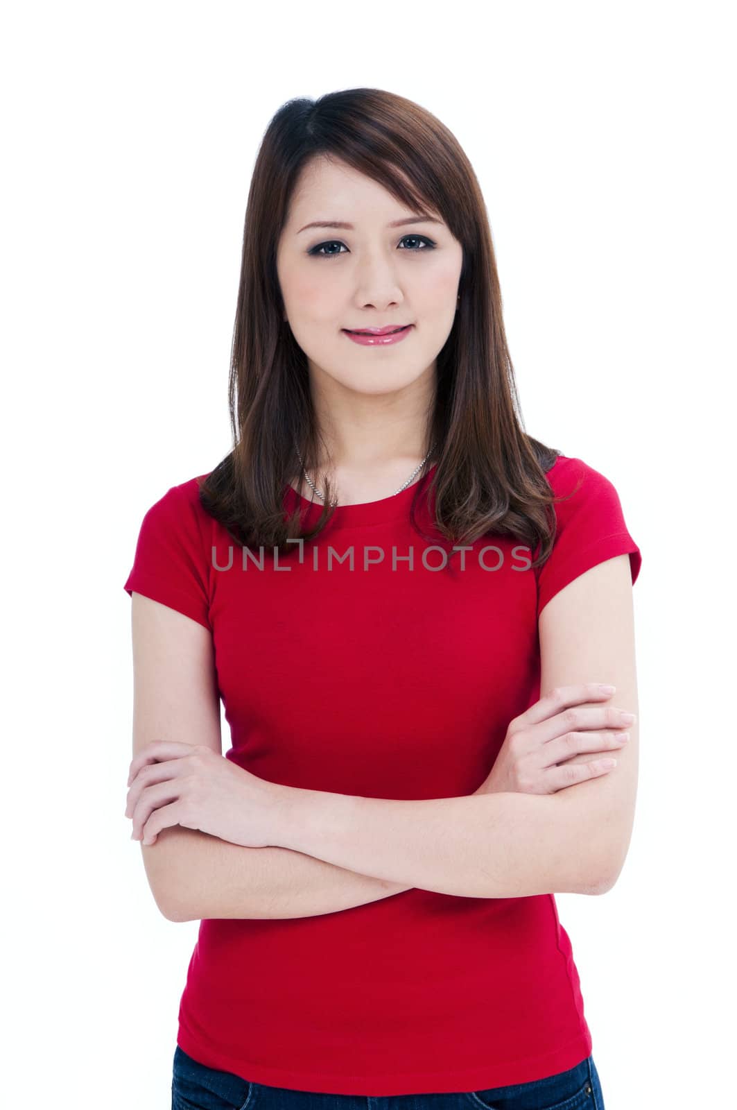 Portrait of a beautiful young woman with arms crossed, isolated on white.