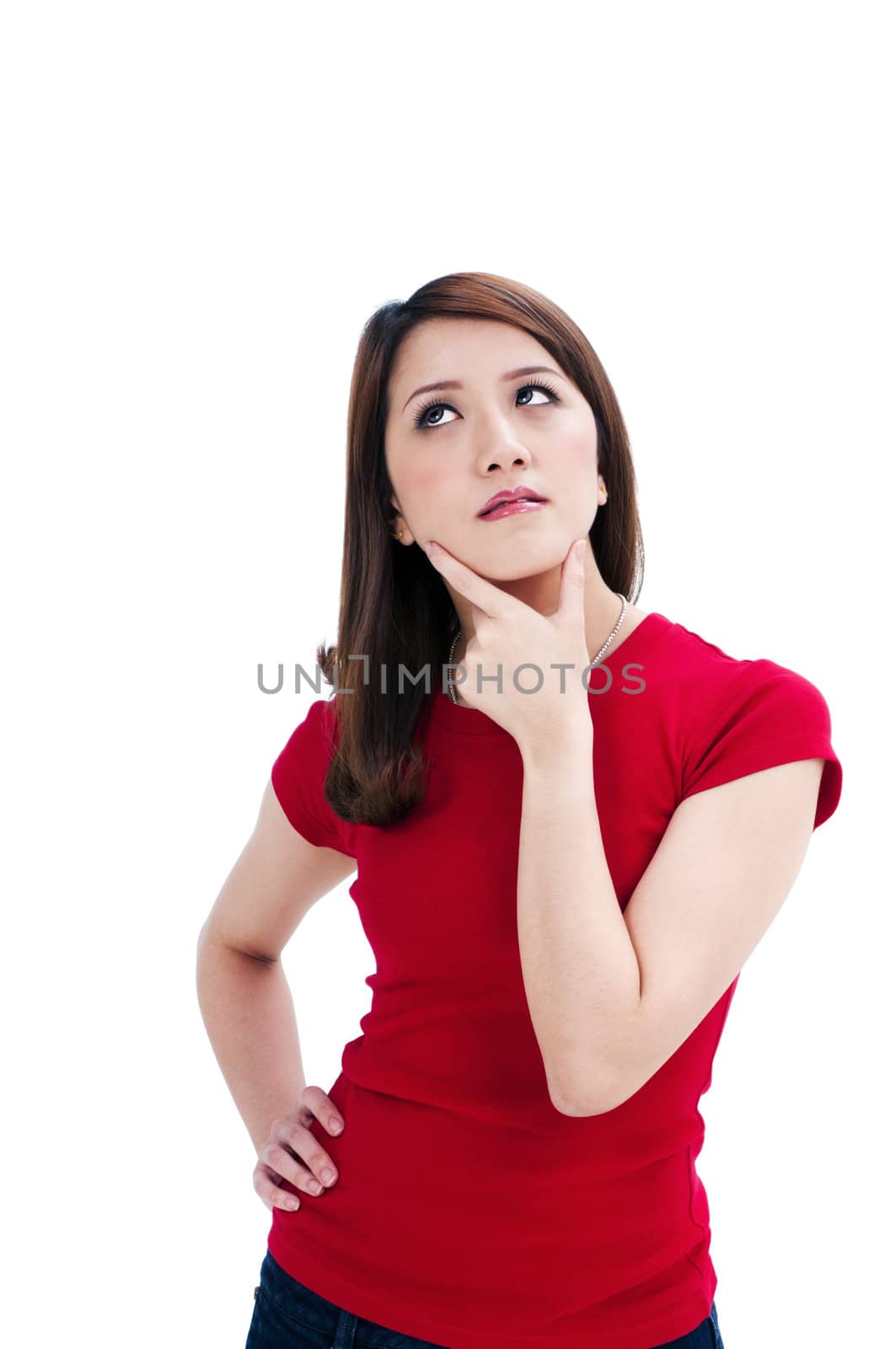Portrait of an attractive young woman thinking, isolated on white background.
