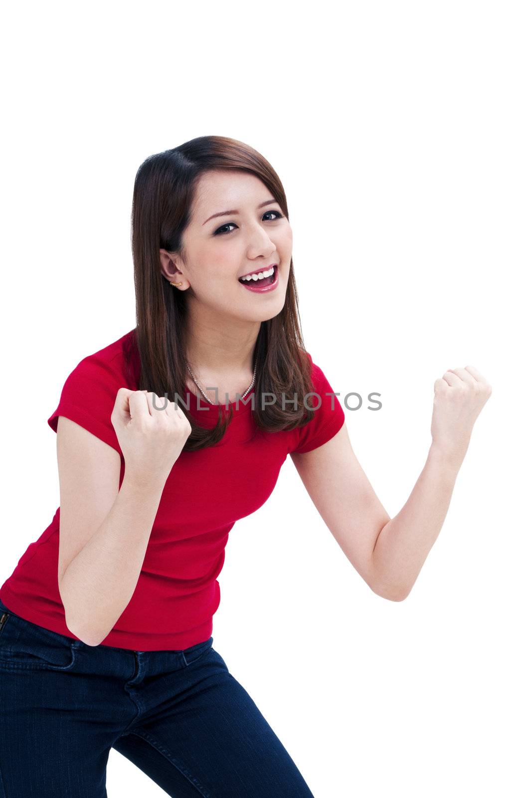 Portrait of a beautiful young woman cheering with her arms raised, isolated on white background.